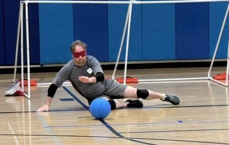 Mike Meyers is blocking a ball during practice.