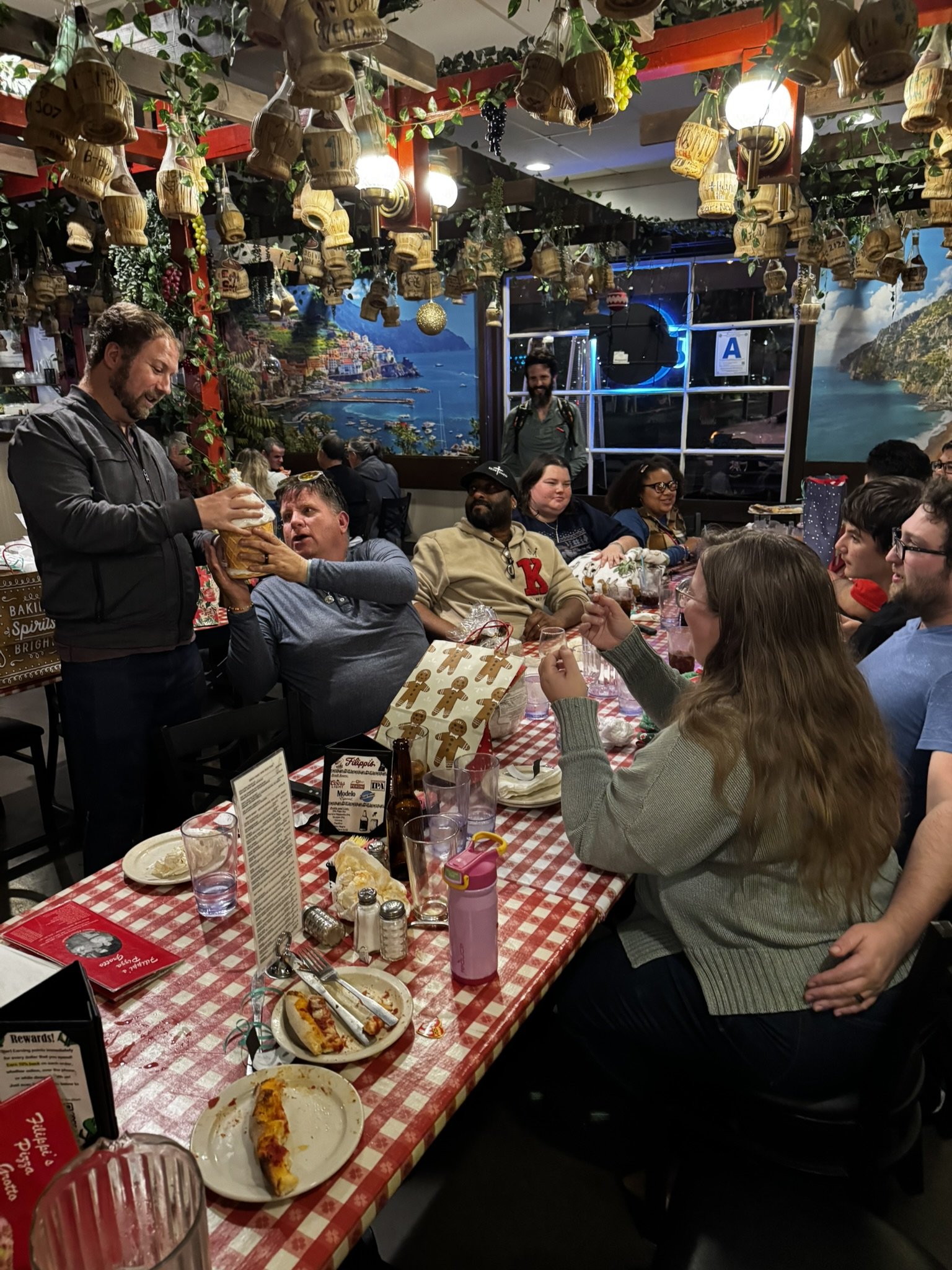 A group photo taken at the 2025 San Diego Goalball holiday pizza party.