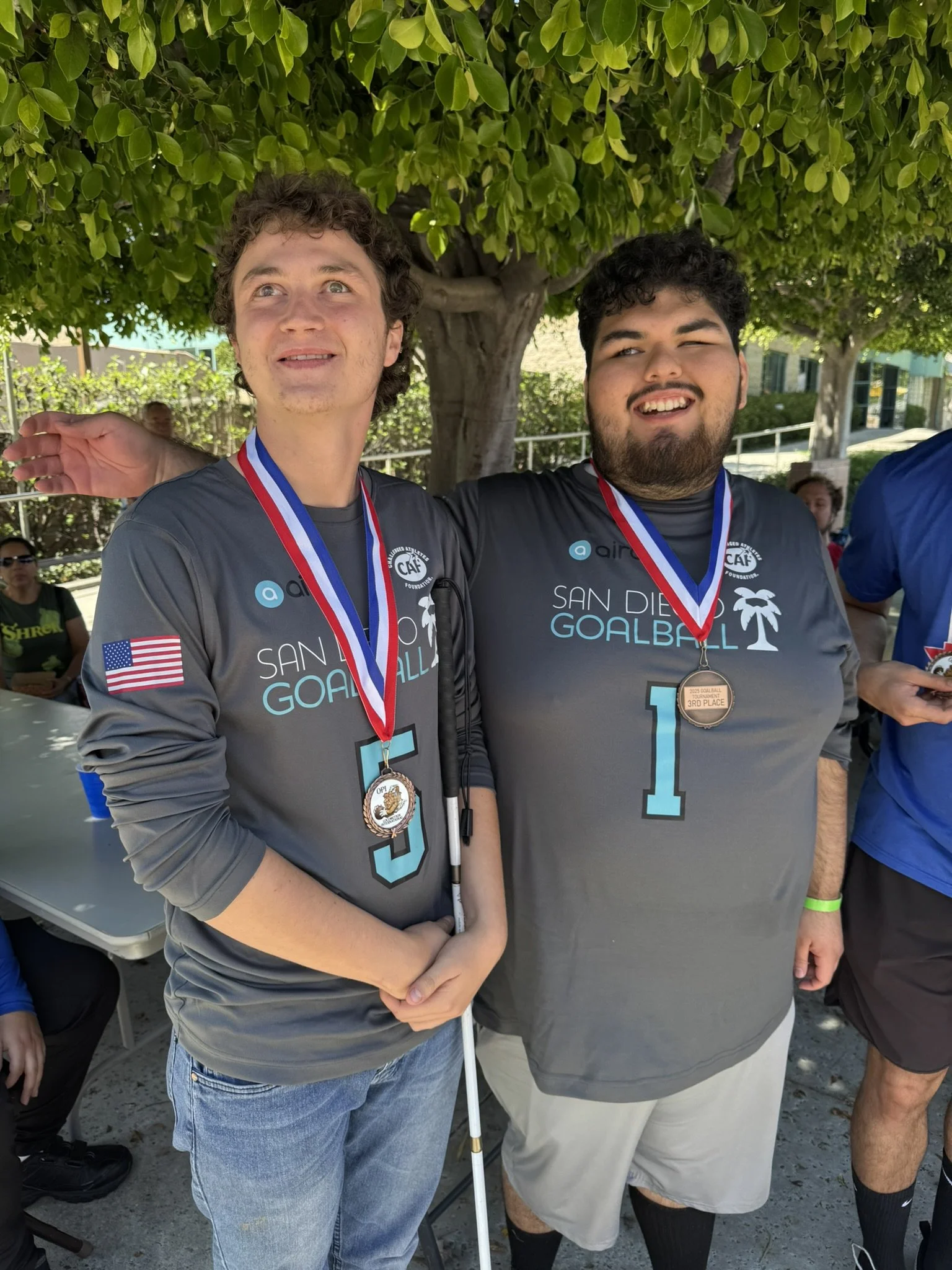 Jayden and Angel posing together at the 2025 OPI LA Goalball tournament after winning their medals.