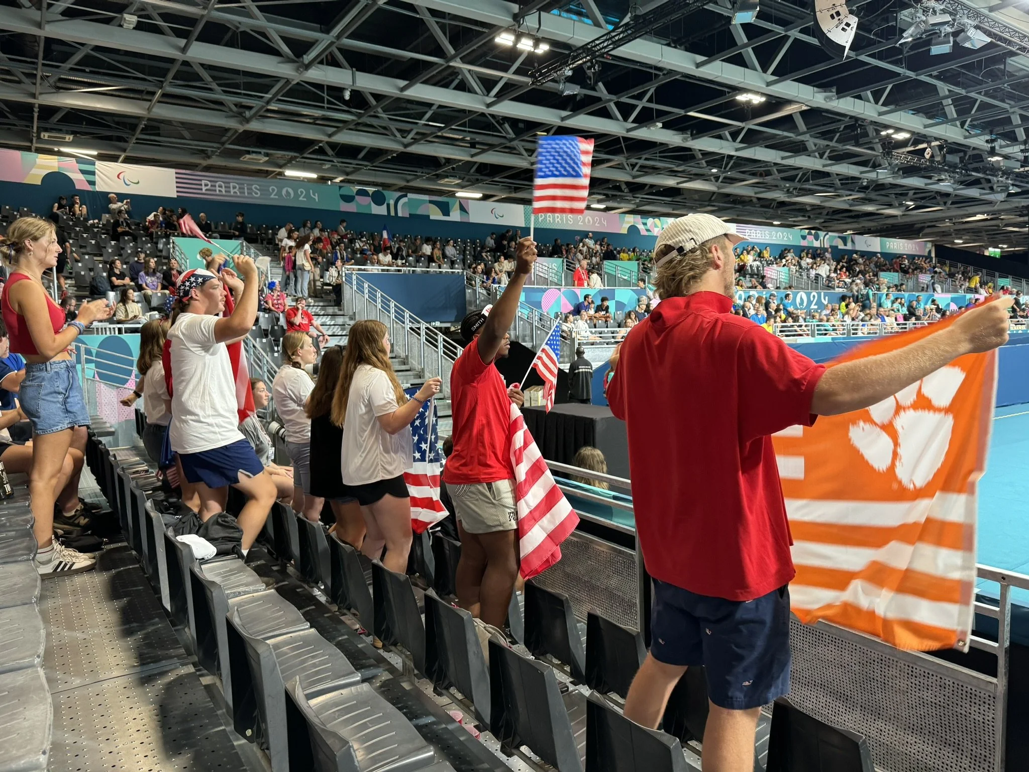 Picture of the USA contingent cheering the USA Goalball team at the 2024 Paris, France Paralympics.