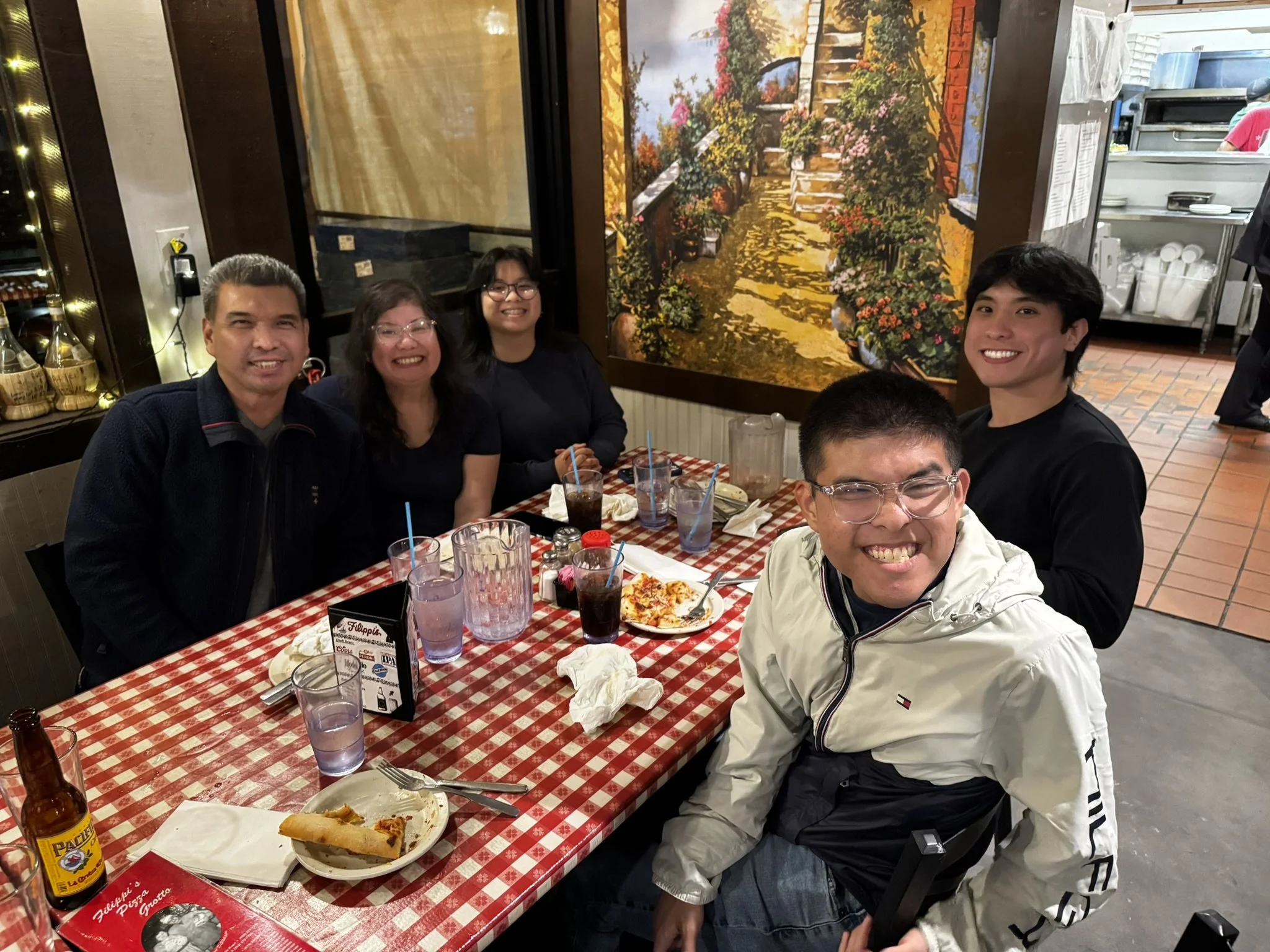Darren and his family during the SD Goalball 2026 holiday pizza party in San Diego.