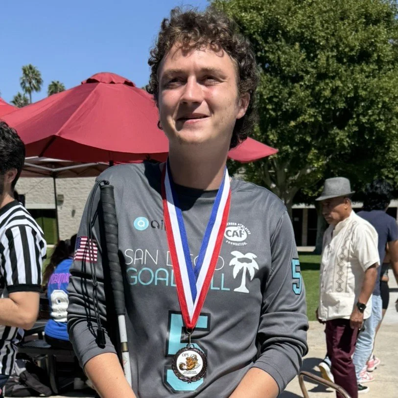 Jayden wearing his medal after placing at the 2025 OPI Tournament in Los Angeles.