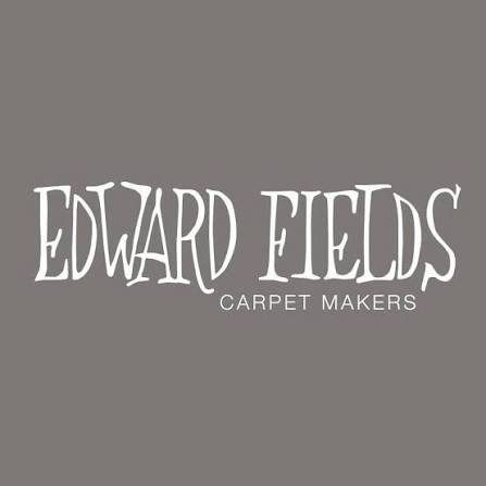 Logo with white text on gray background reading 'EDWARD FIELDS CARPET MAKERS'
