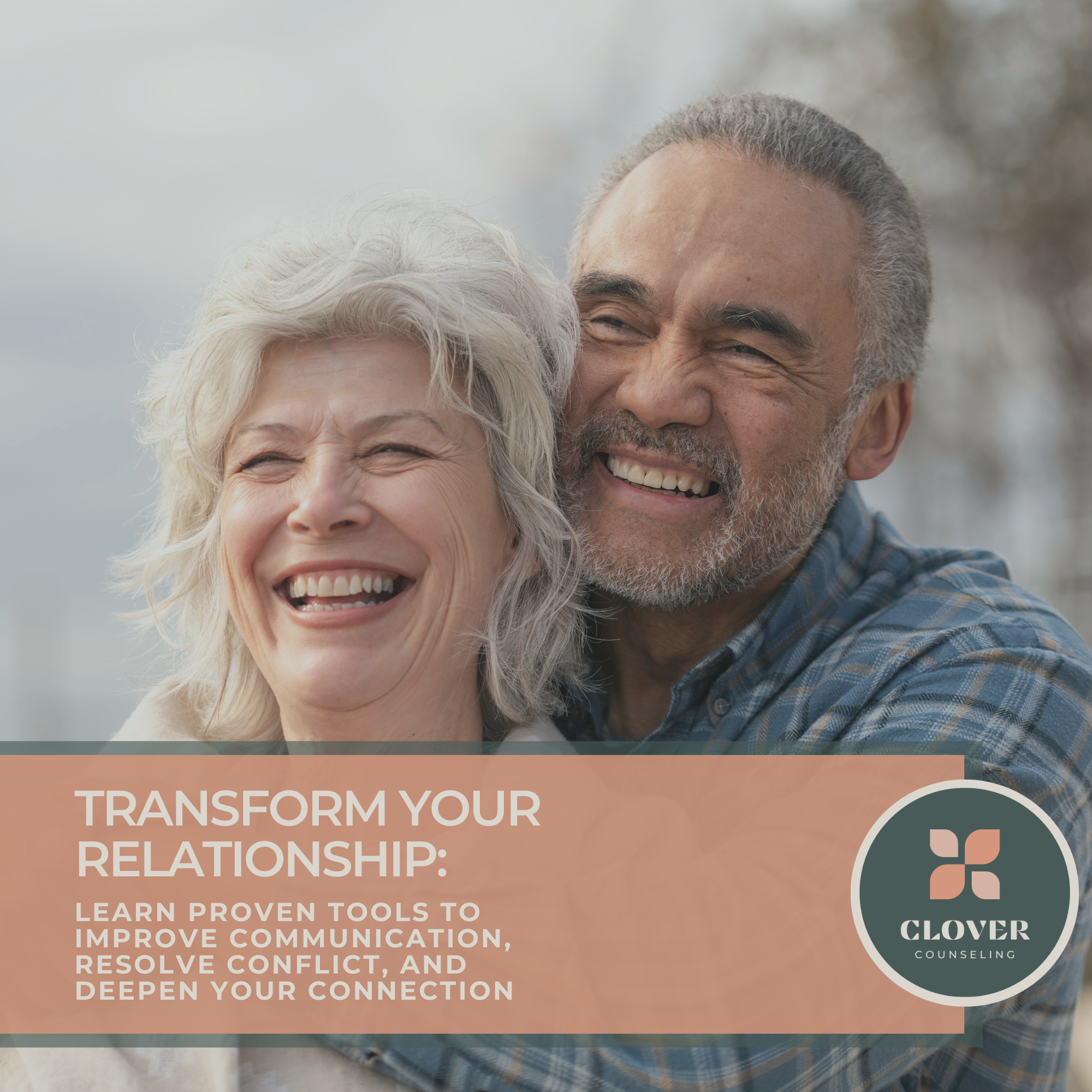 Close-up of senior Caucasian woman with white hair and senior African American man with gray hair smiling outdoors.