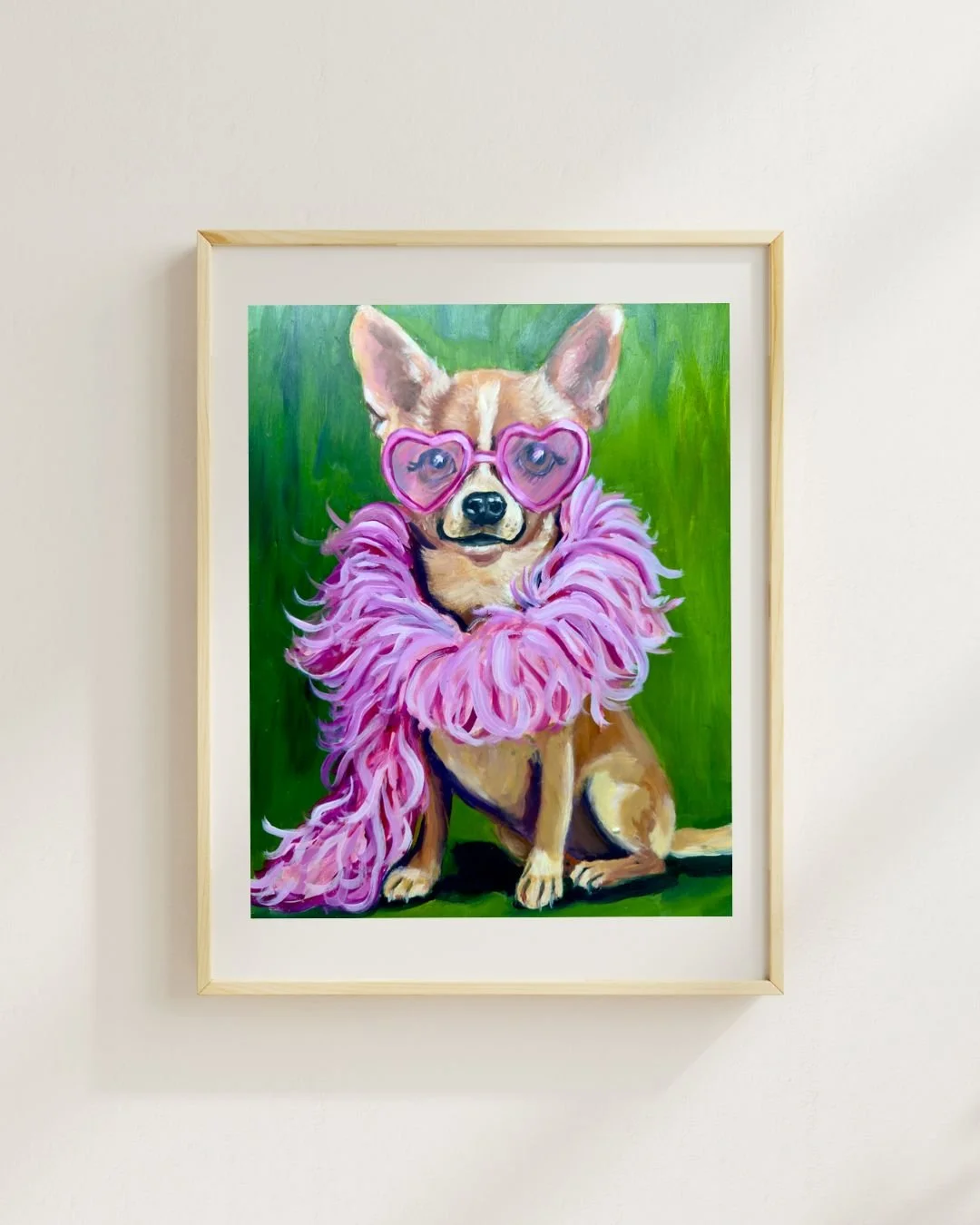 Original oil painting of a brown Chihuahua dog sitting against a vibrant green background. The dog is wearing large pink heart-shaped sunglasses and a thick, fluffy pink feather boa.