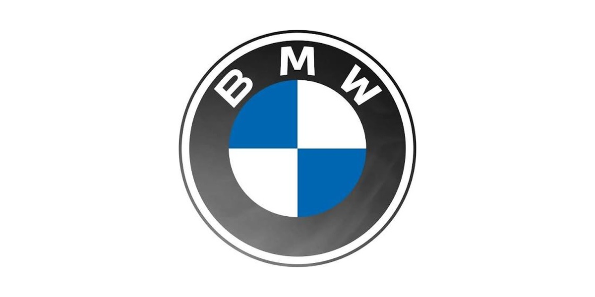 Close-up of a BMW logo with a black and gray background.