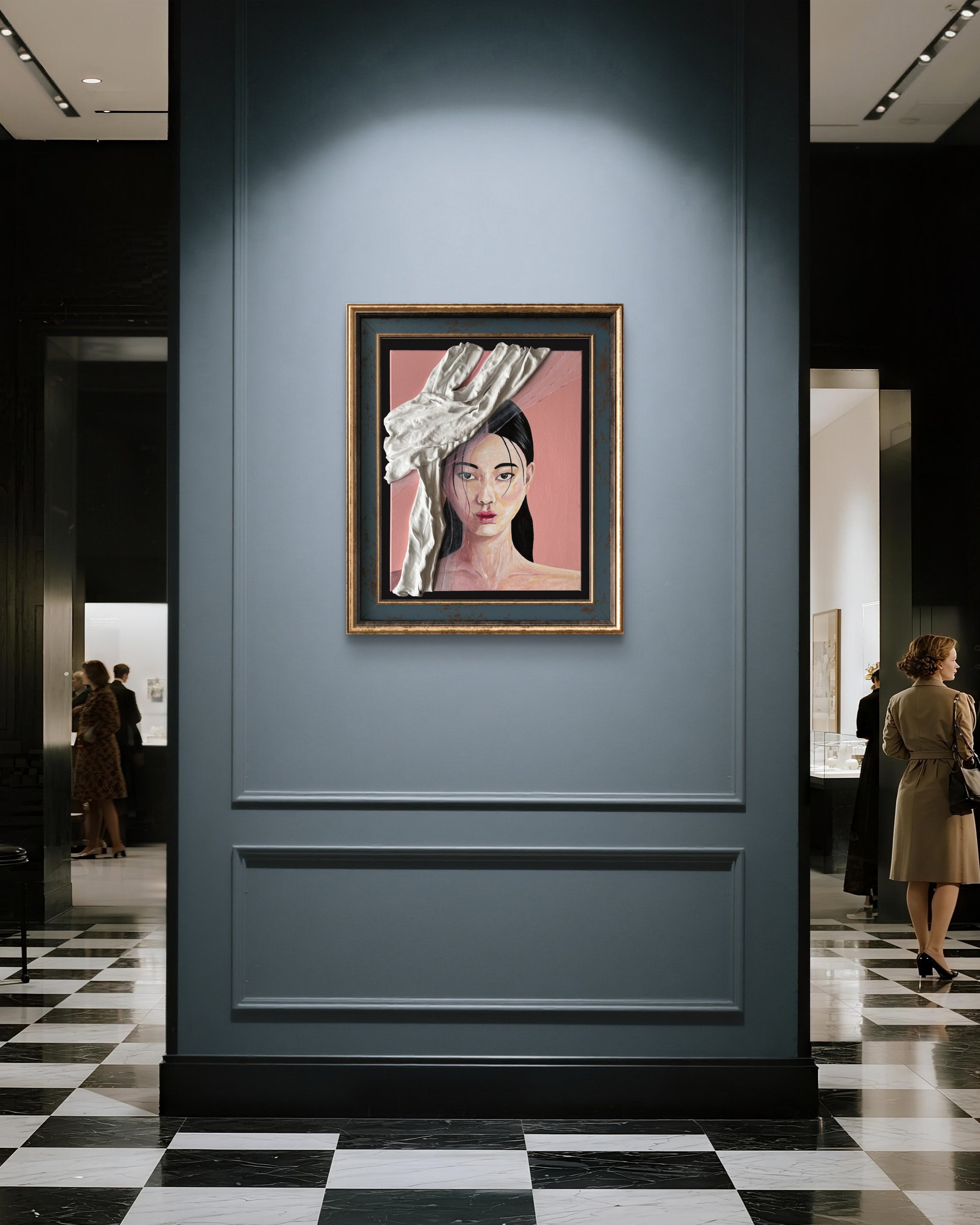 A framed portrait of a woman with long black hair and light makeup, partially covered with a crumpled white cloth, is displayed on a blue wall inside an art gallery or museum, with visitors visible in the background.