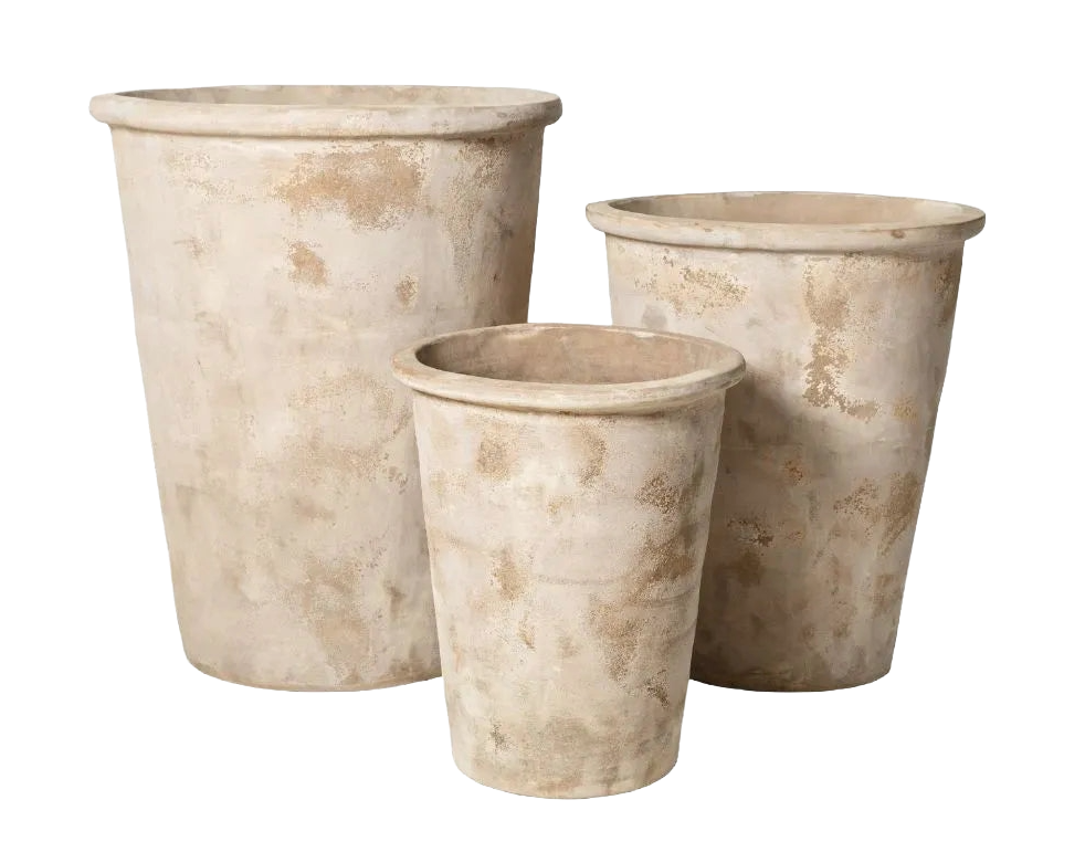 Three large empty weathered flower pots made of stone or ceramic in different sizes.
