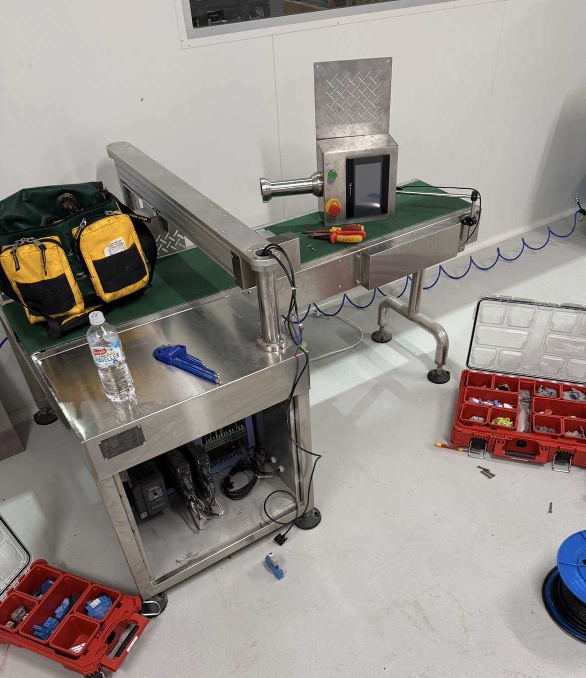 A stainless steel Counting conveyor with a HMI upgrade being performed.