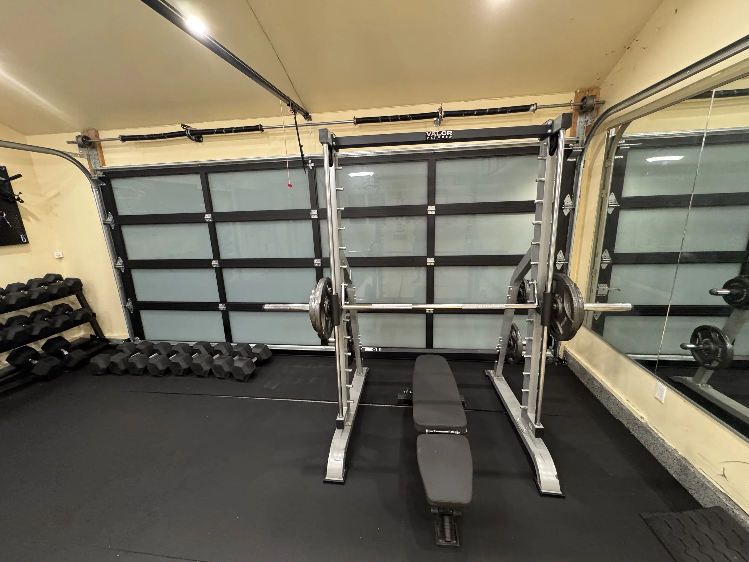 Squat rack and bench setup in Toluca Lake private gym