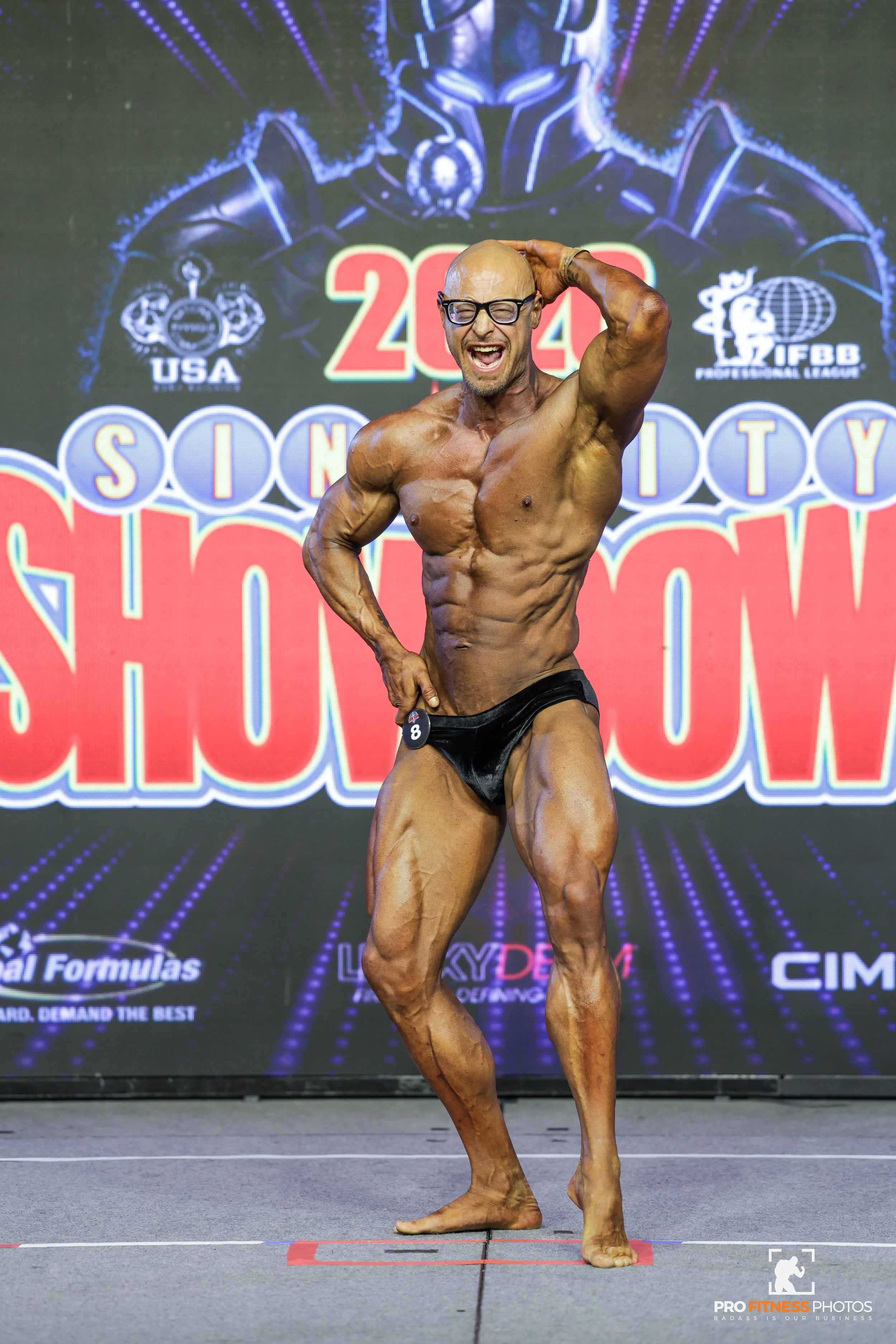 Stuart Paul posing at bodybuilding competition