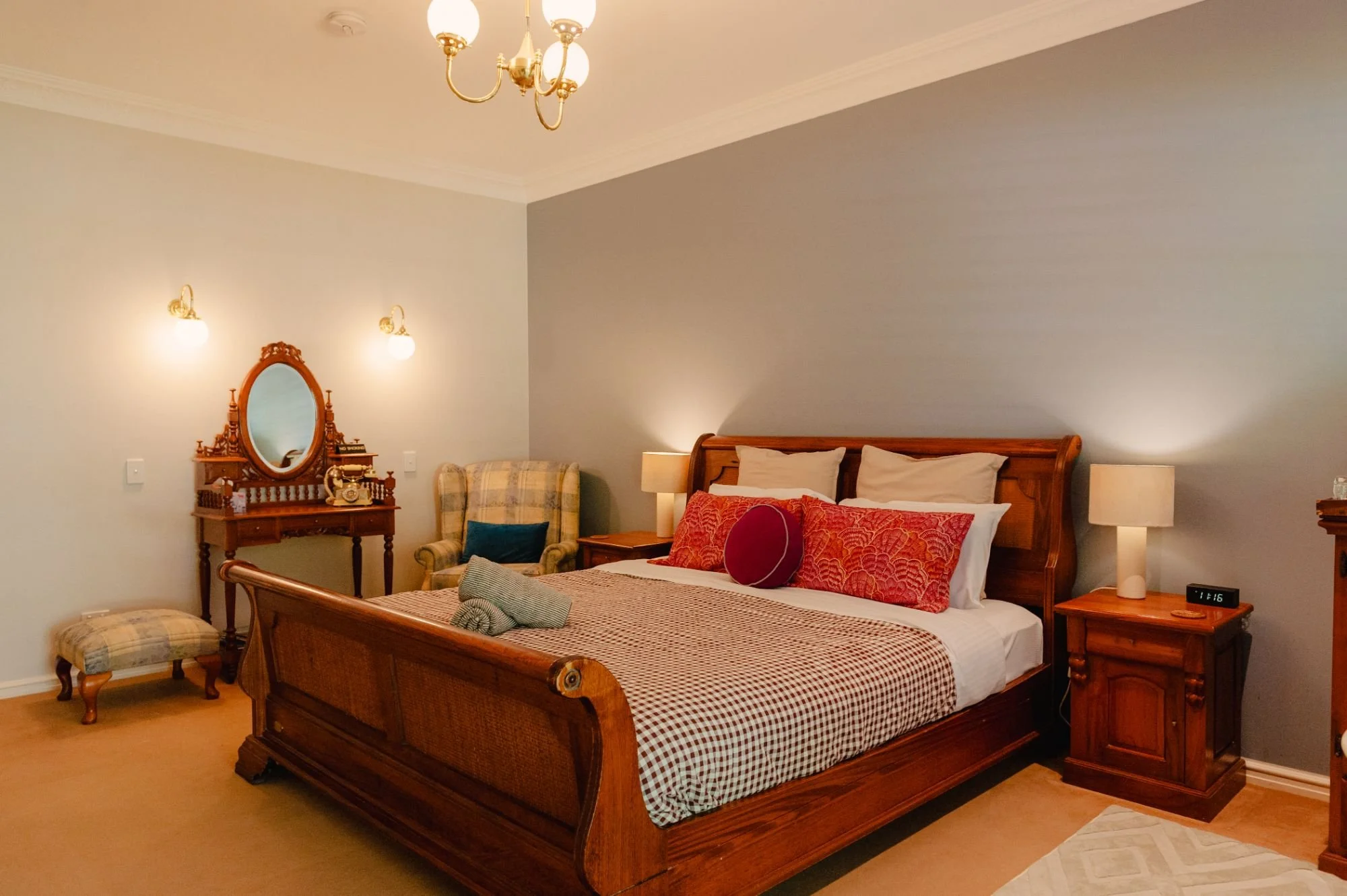 A cozy bedroom with wooden furniture.