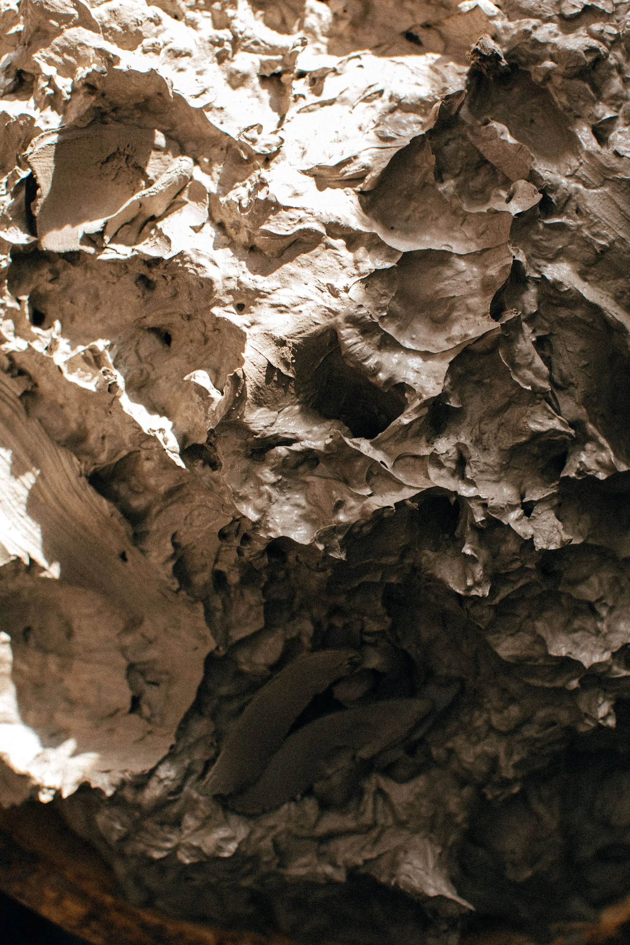 Close-up view of textured, layered clay in a reclaim pile.