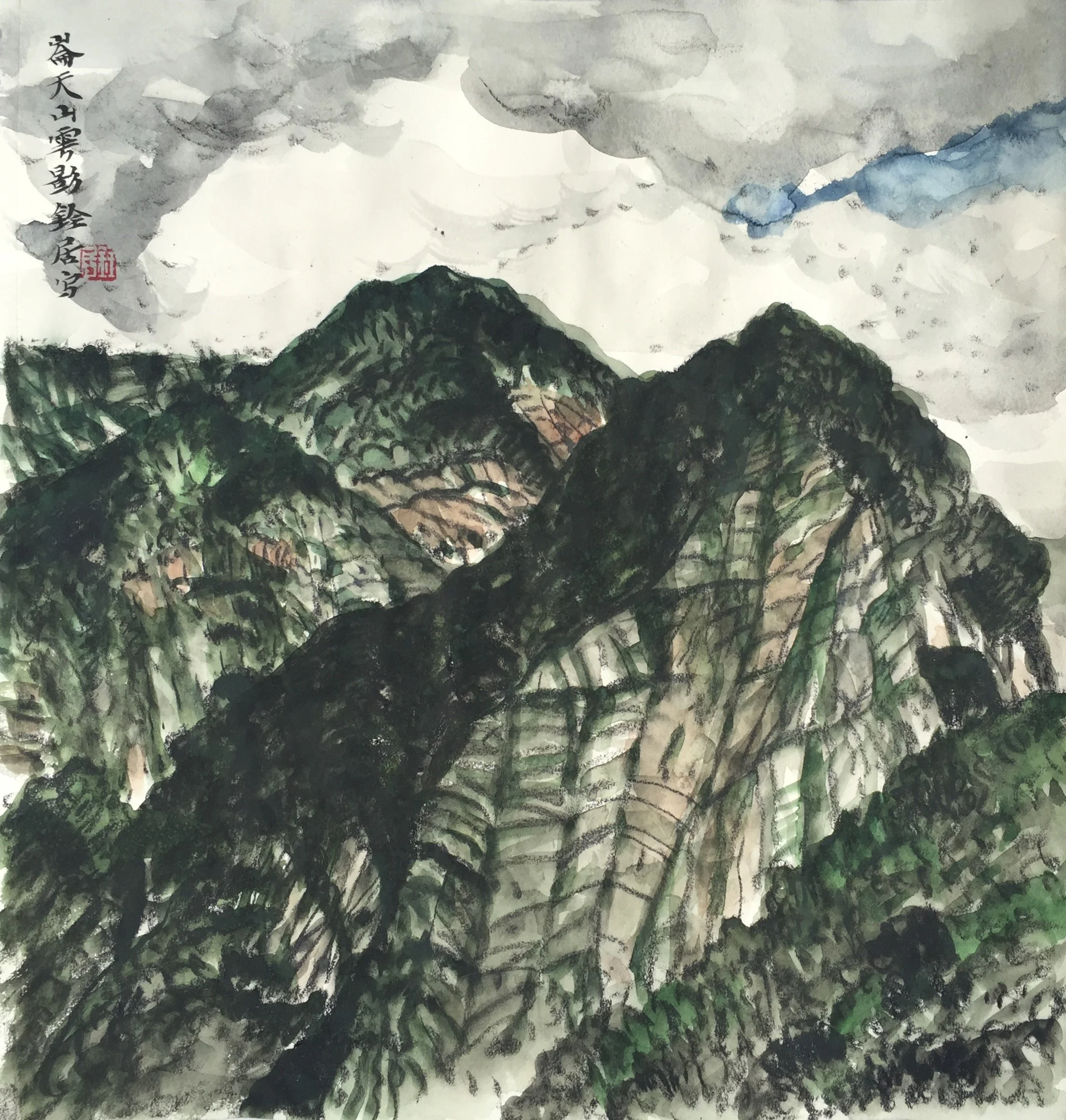 A traditional Chinese landscape painting of green mountains under a cloudy sky, with Chinese characters and a red seal on the left side.