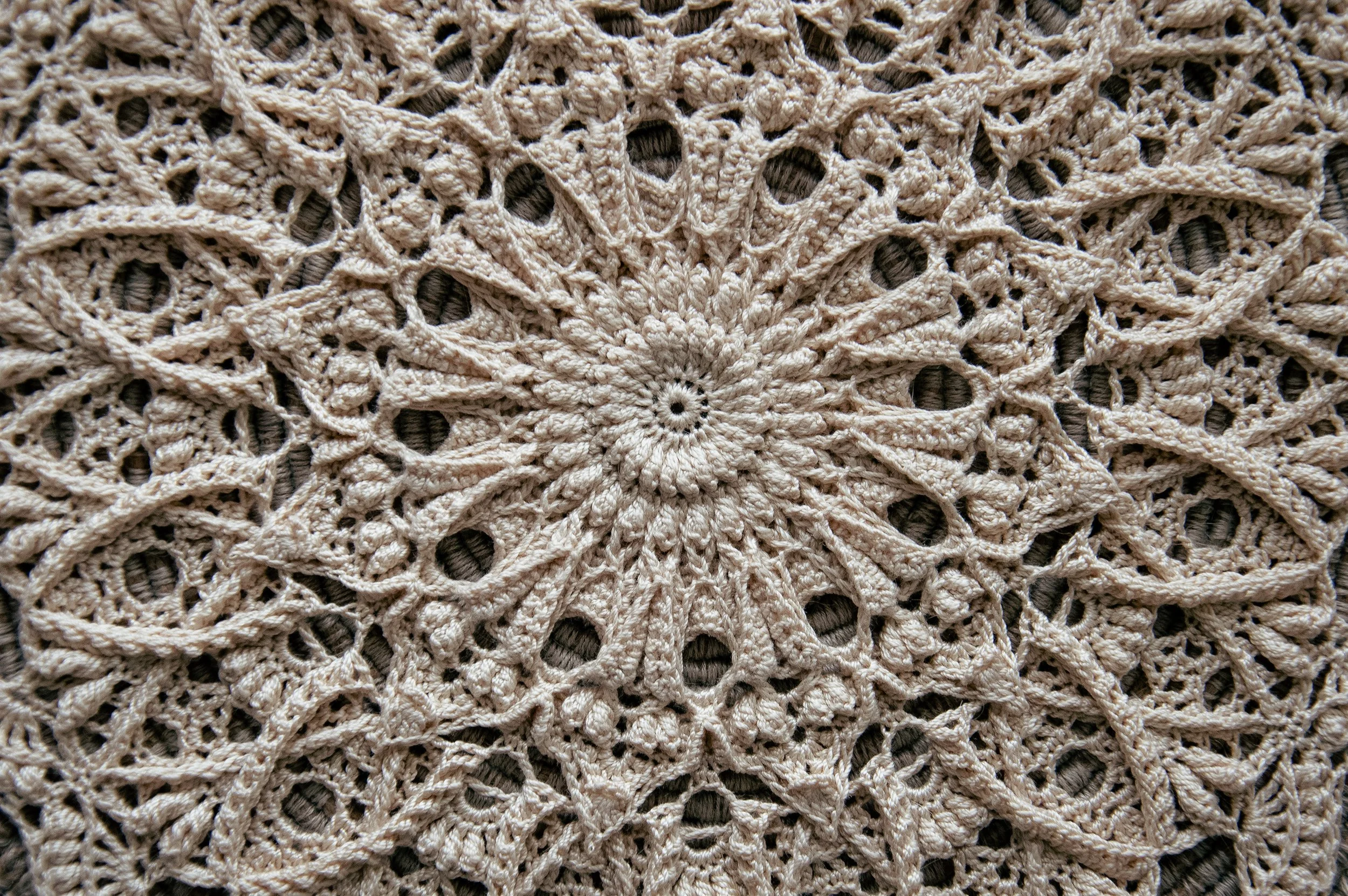 сlose-up of the Mathilde crochet doily with intricate textured lace details