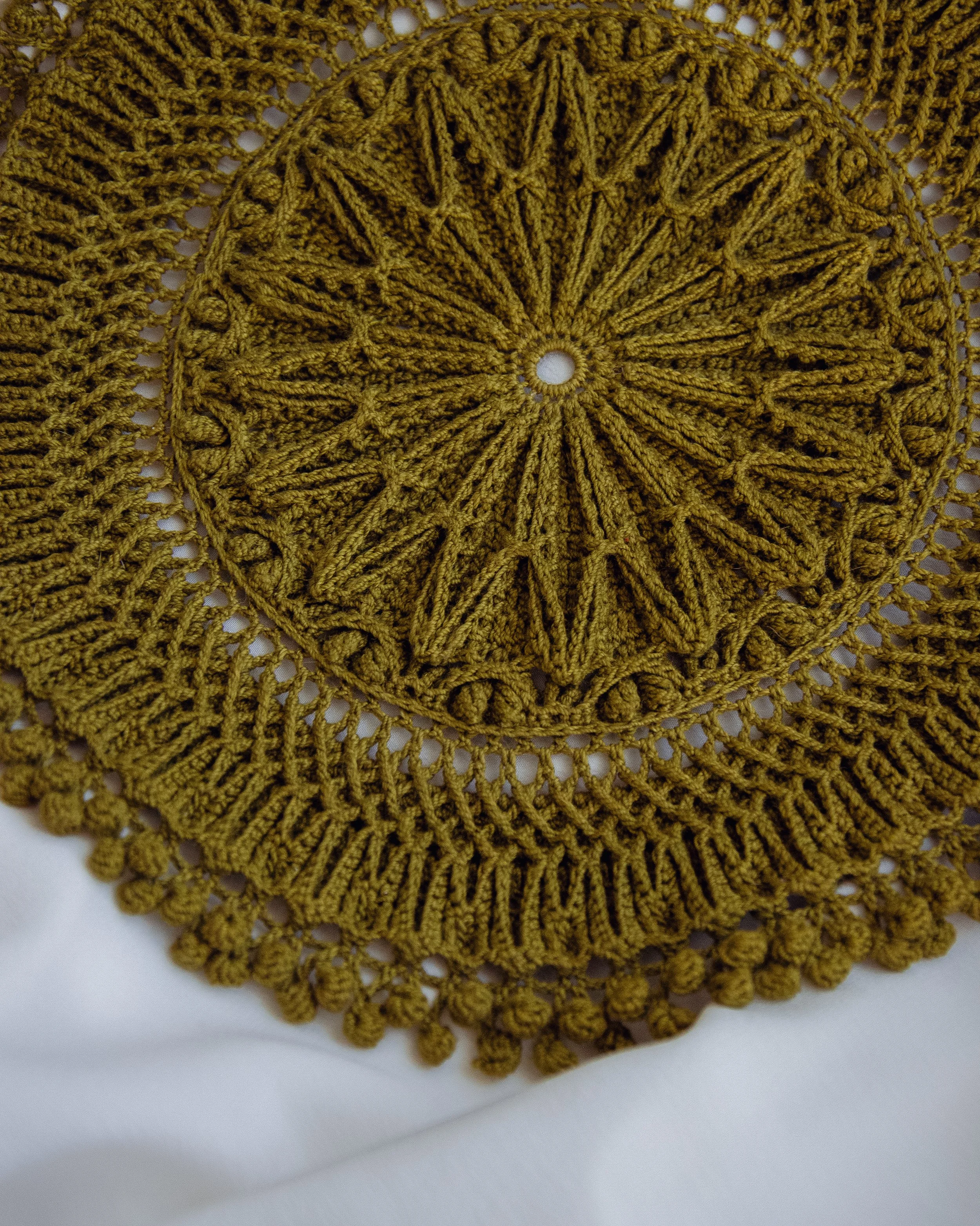 olive green Marita thread crochet doily with textured floral details
