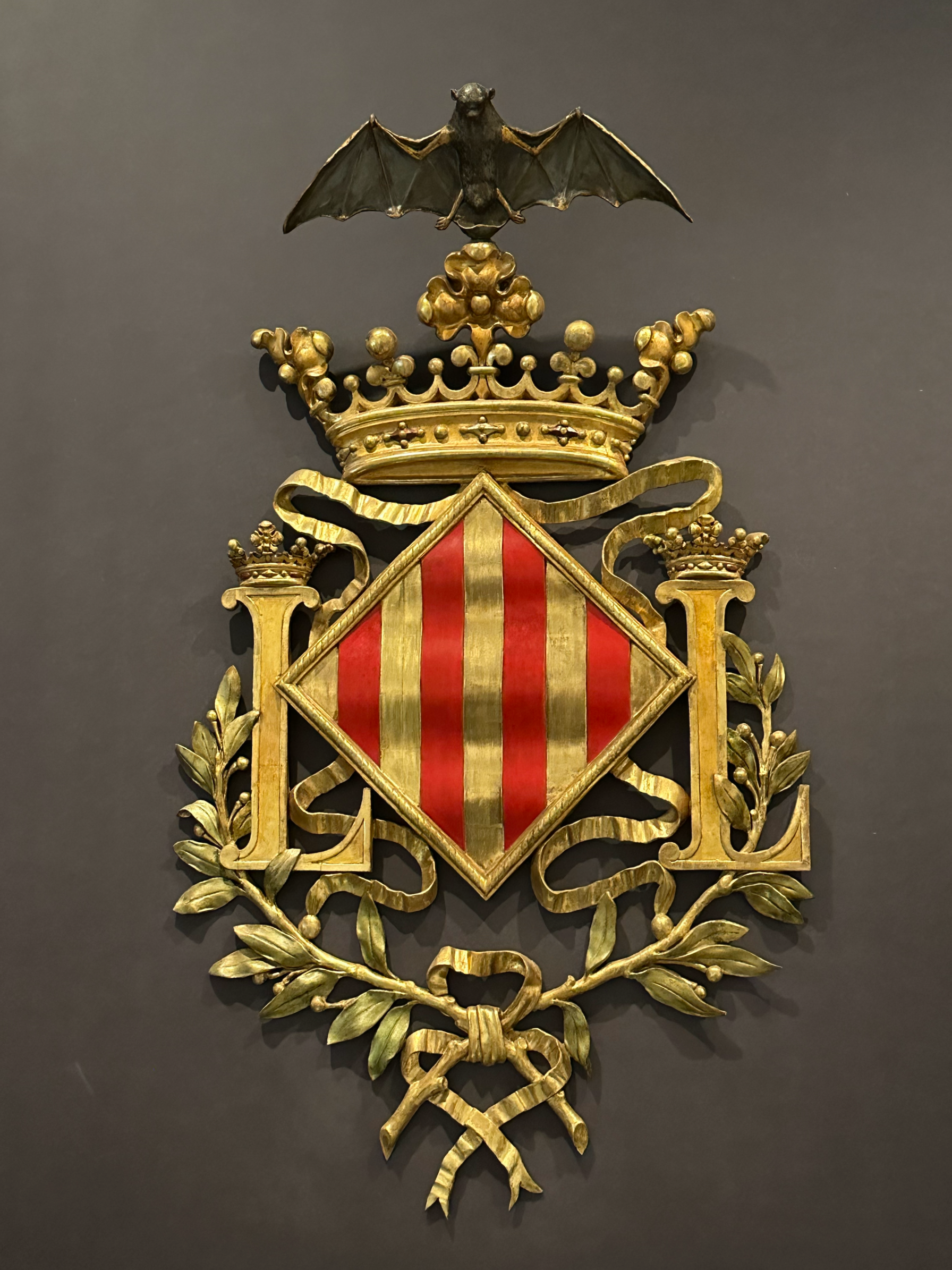The coat of arms for the City of Valencia. Notice the bat at the top, which is on almost all symbols related to the city.  Common folklore suggests that during the 13th century war for rule over Valencia, a bat flew into the tent of King James I waki