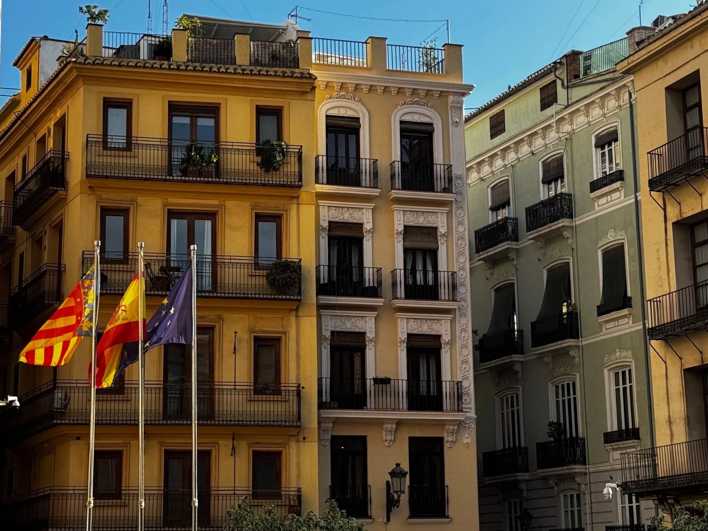 We loved capturing the flags of Valencia, Spain, and the EU right outside the Plaza de la Virgen.