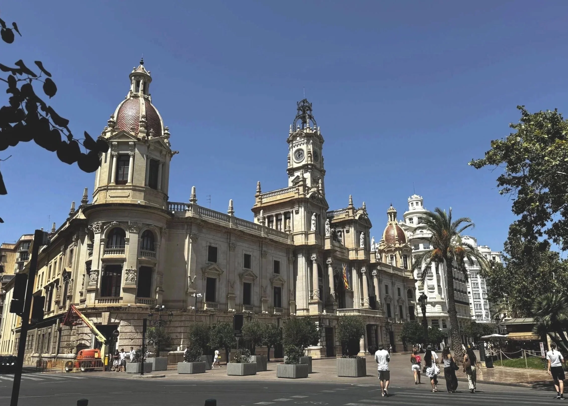 City Hall.  It's open to the public, includes a great museum (with A/C :)), and features a great balcony to see a beautiful view of Plaza del Ayuntamiento. 