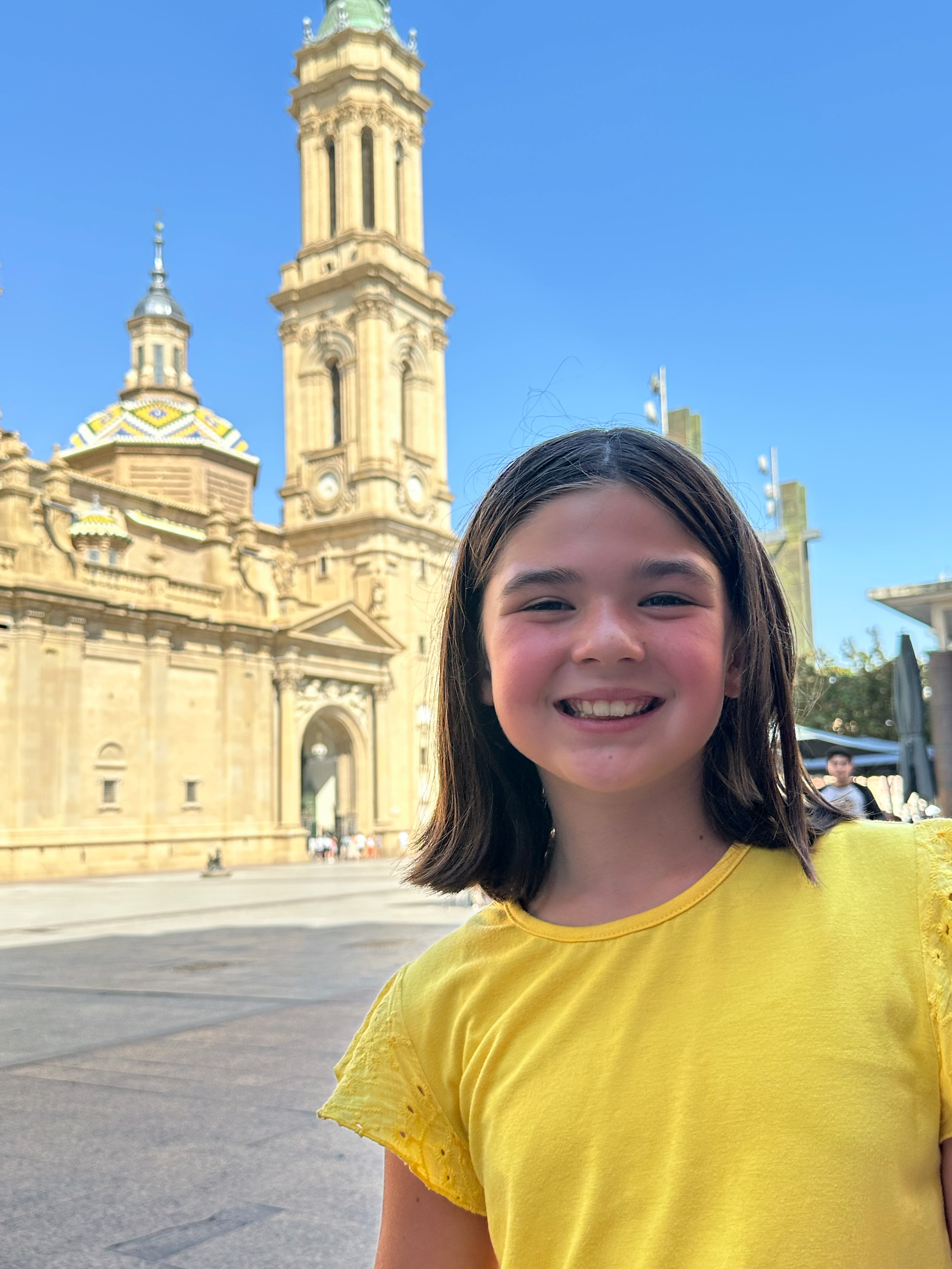 We made a quick stop in Zaragoza for lunch. We only saw a small section of the town square and peeked into the cathedral.  It was beautiful. Amelia matched the tiles on the roof of the cathedral in their bright yellows, greens, and blues.  