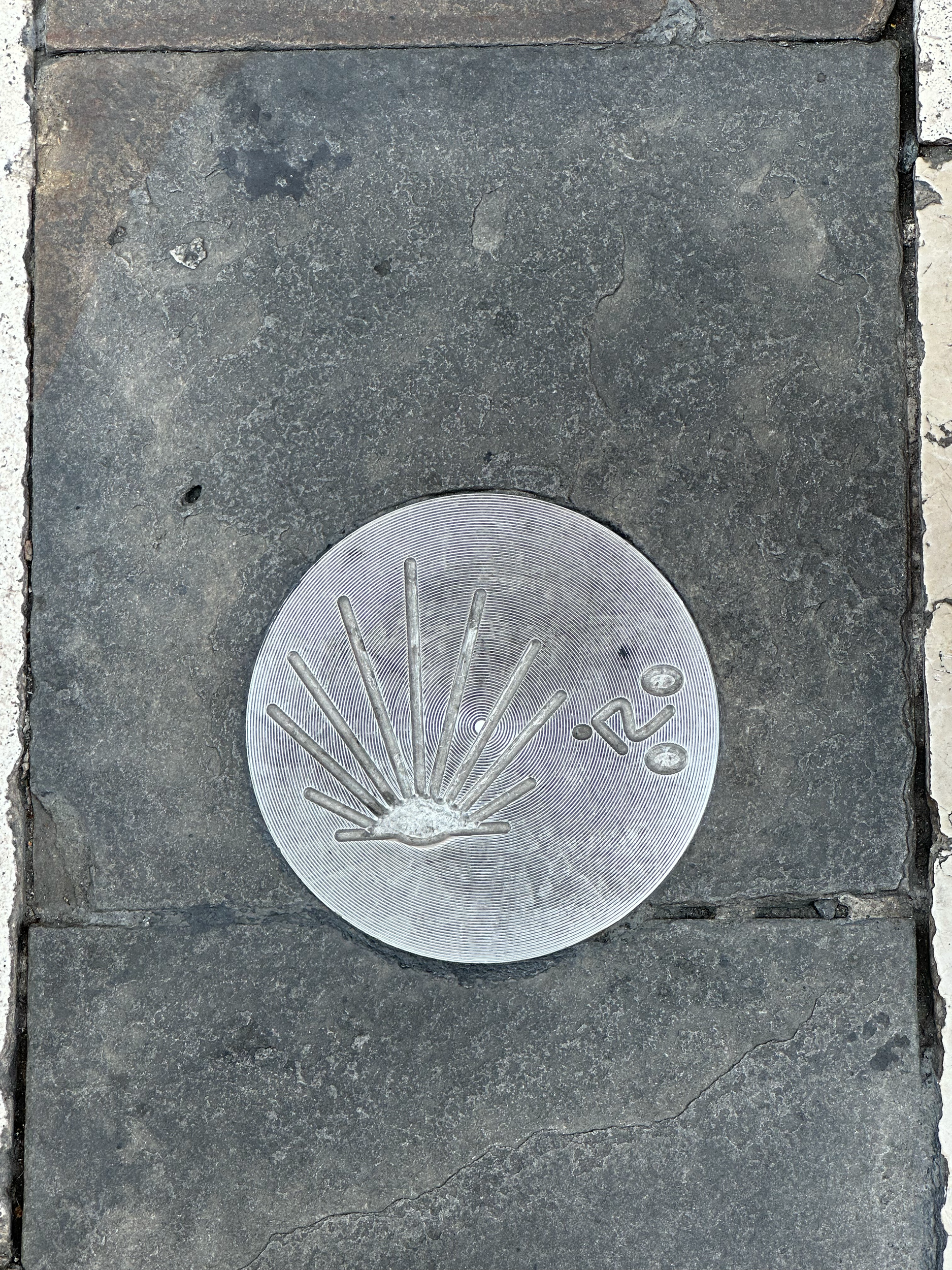 Back out on the street, you will find the shell symbol marking the streets or on the building walls. This signifies the path of the Camino de Santiago, a hiking/pilgrimage network of trails that lead to the town, Santiago de Compostela, which is said