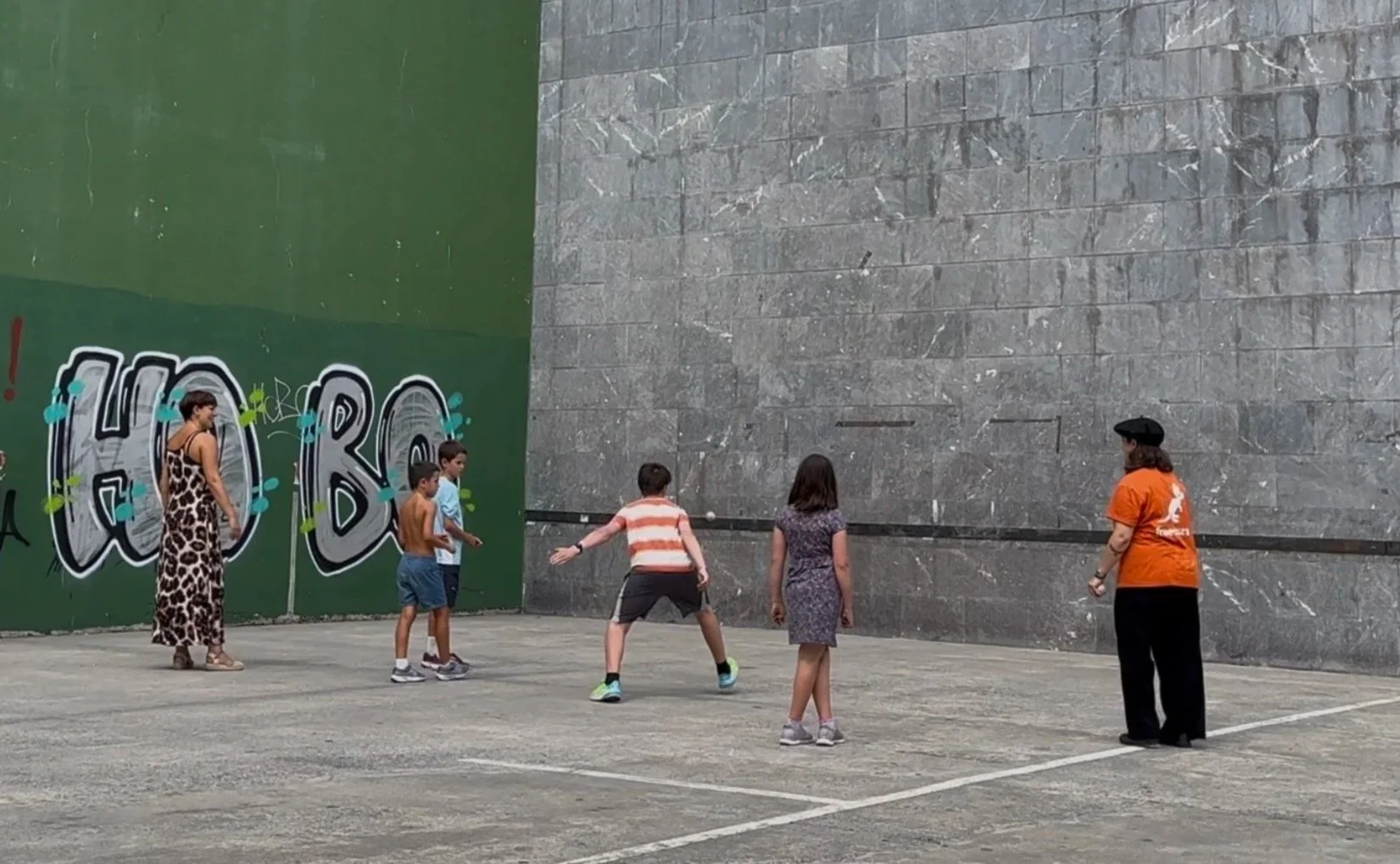 Maria took us to a court to tell us about "pelota ball," a game that is part of Basque tradition.  How fun that a family was there playing and invited our kids to join in.   (There is a Valencian variation of the game with a slightly larger ball).