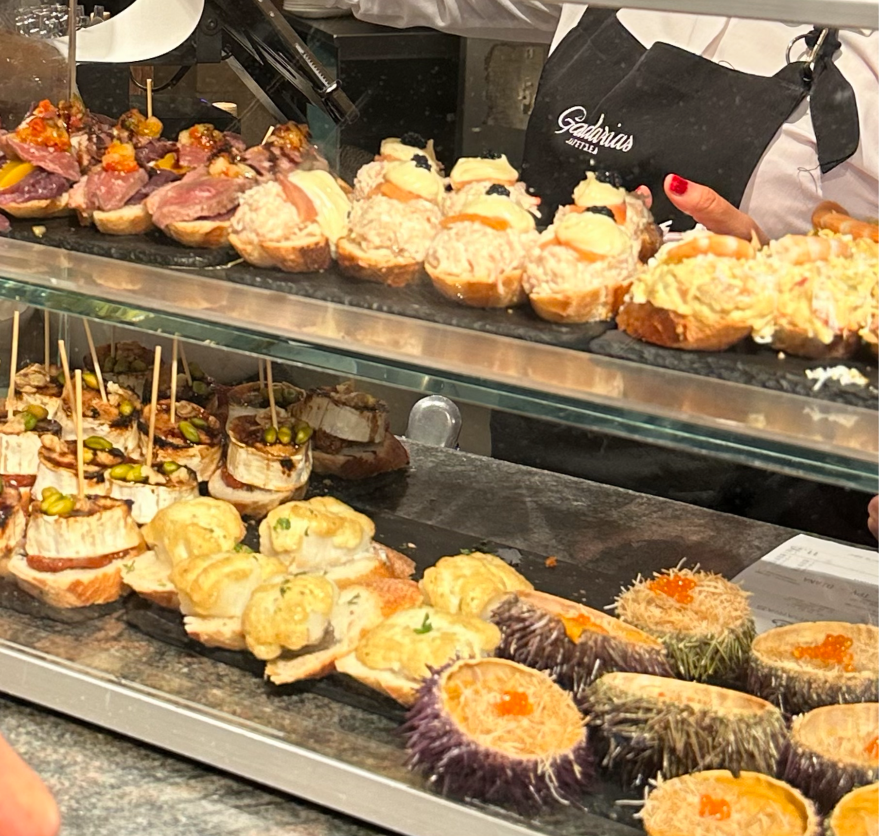 We ended up at Casa Gandarias bar, well-known for their pintxos.  We had a lovely steak brochette, risotto, and croquettes. But I wanted you to see some of the other choices.  We saw lots of people coming out of the restaurant with the seafood gratin