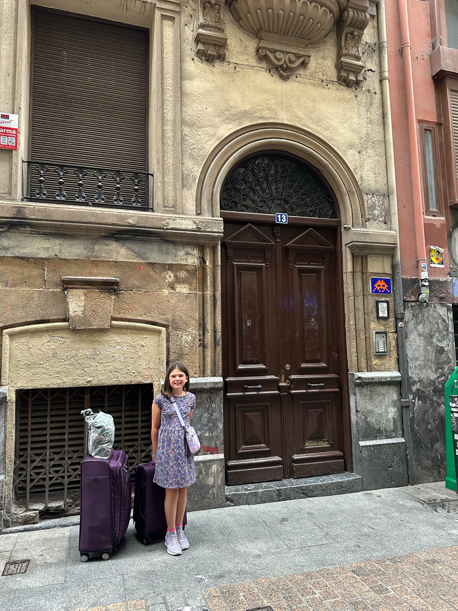 Little did we know that we would be carrying all of our luggage down the cobblestone roads to our apartment that was 15 minutes away.  But look at that amazing door! (And peep the tile crab on the right- my brother informed me that this is street art