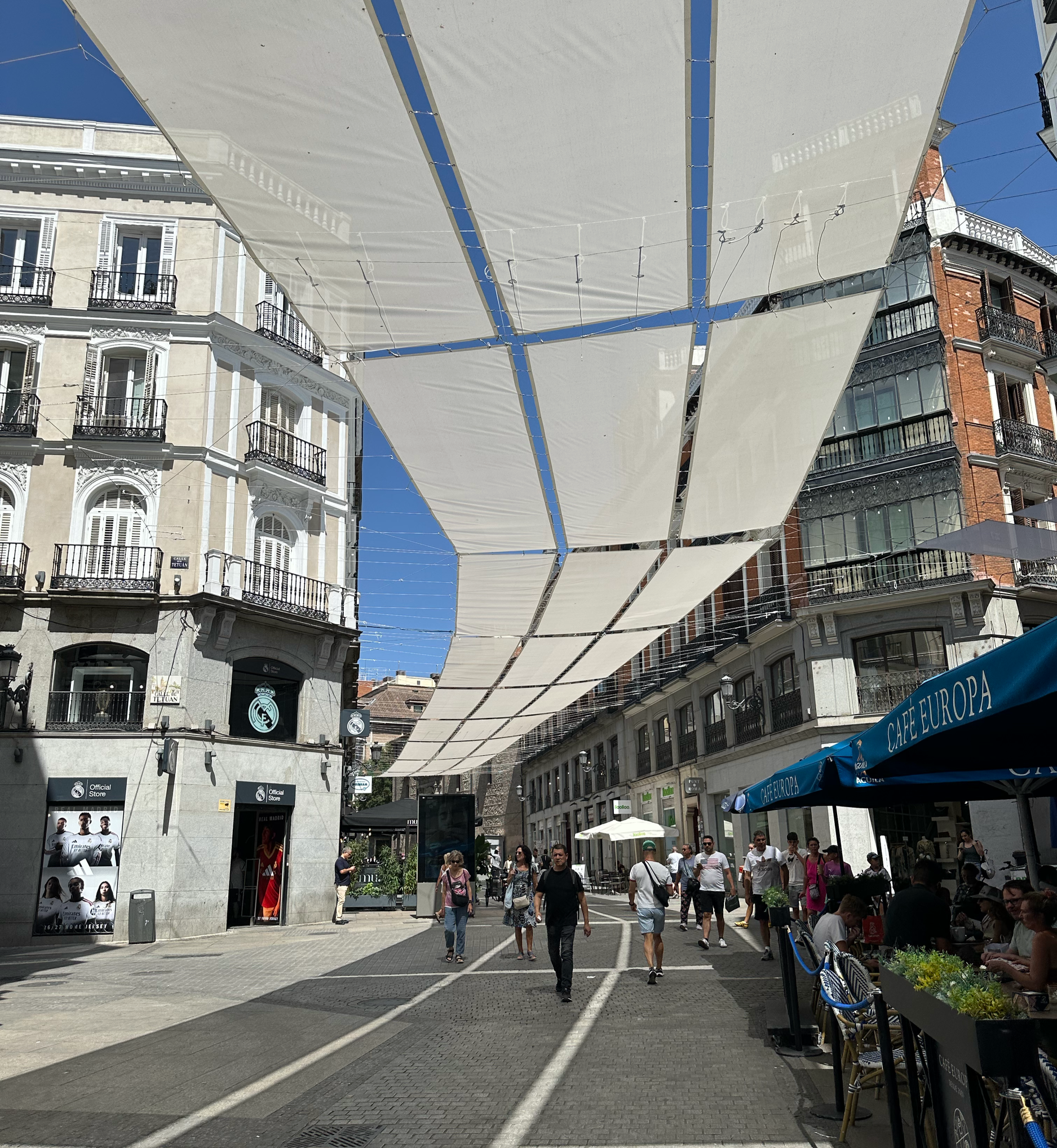 We stopped at Puerta del Sol and headed toward El Corte Inglés (think large department store) for a great view of the city.  It was HOT so we were thankful for the overhead canopies.