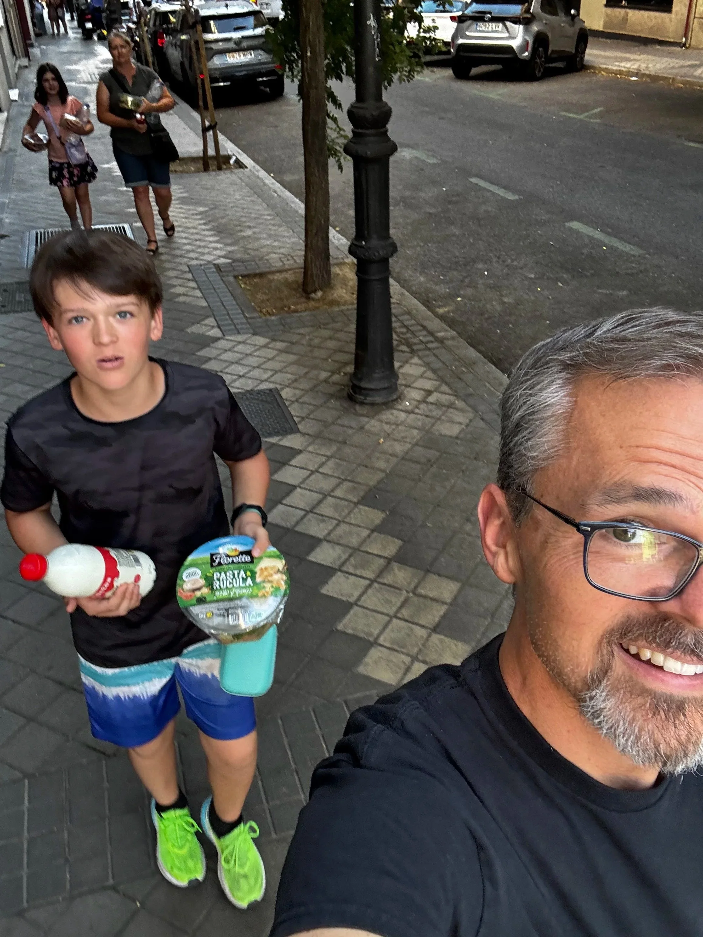 We found a market down the street to get groceries. Why pay extra for grocery bags when you've got 8 hands between you? 