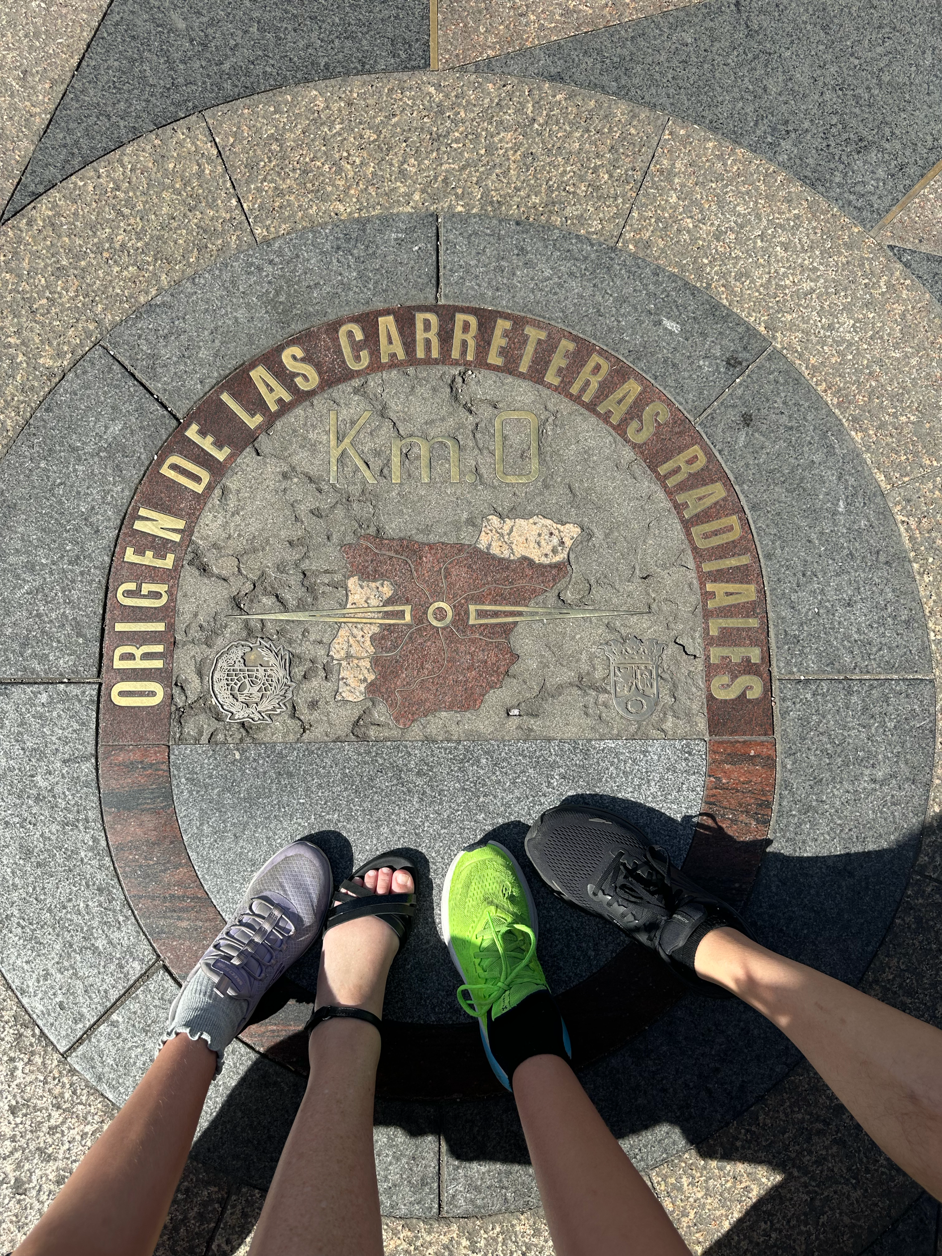 In front of the Casa de Correos is the Km 0 plaque.  This plaque marks the spot from where all major radial roads start in Spain. We all stood on it together!  