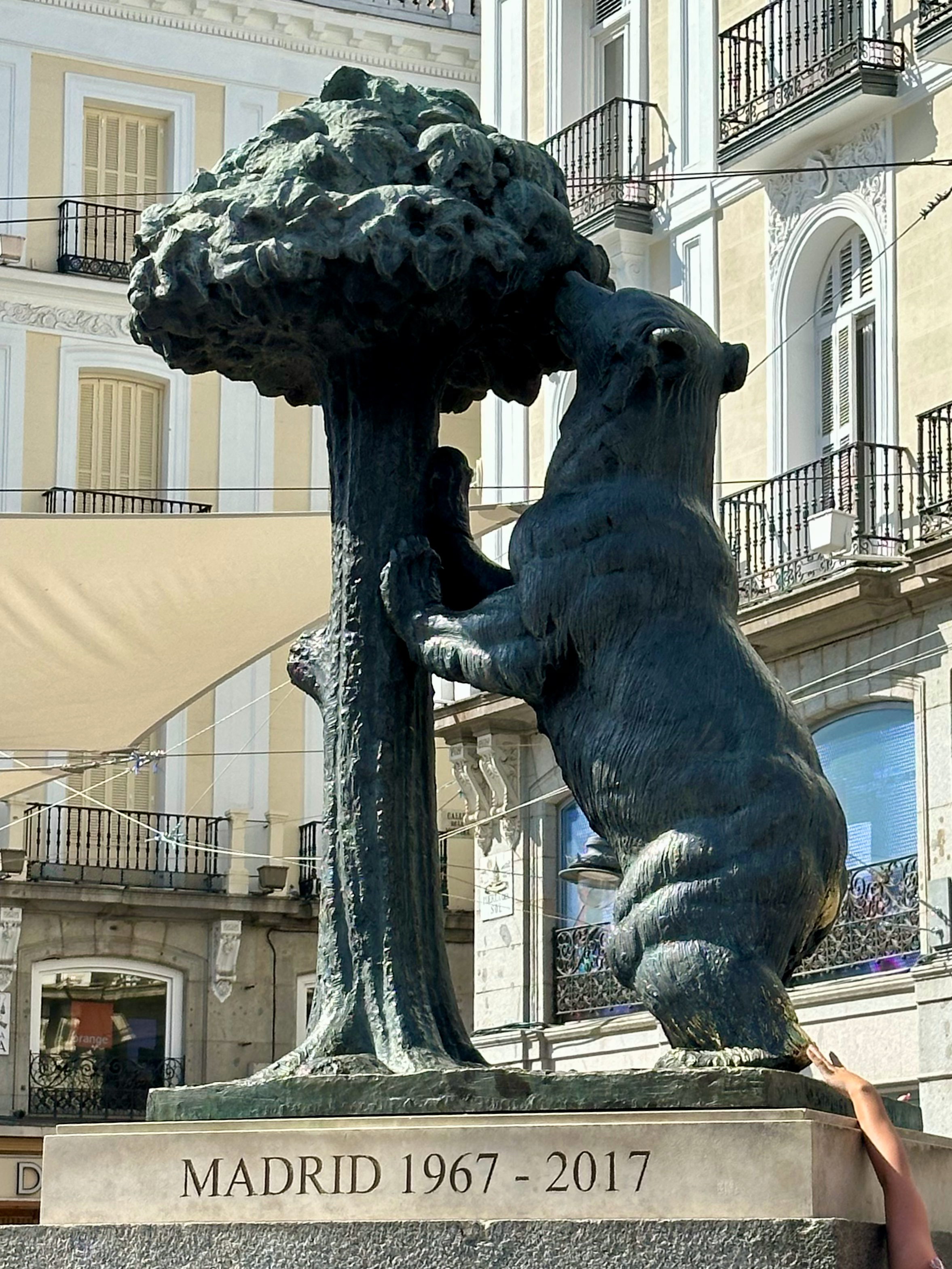The "Bear and Strawberry Tree" (Oso y Madroño) has been on the coat of arms for Madrid since 1222 and this statue is its 3-D projection, which was installed in the square in 1967. So cute! People touch the heel of the bear for good luck- peep the pho