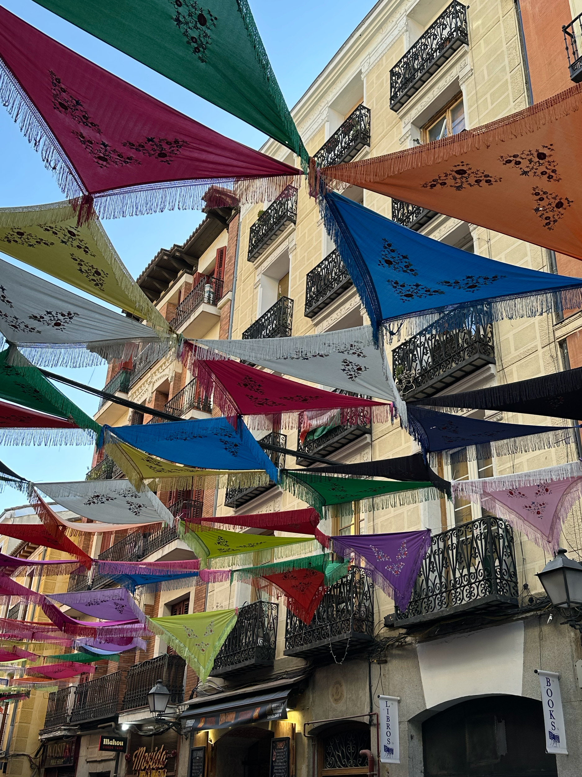 Festival decorations were still hanging above the streets. They are called "Mantones de Manila" (Manila silk shawls) and are a part of the traditional dress. During Spanish colonial times, they were shipped to Spain from the Phillipines.  