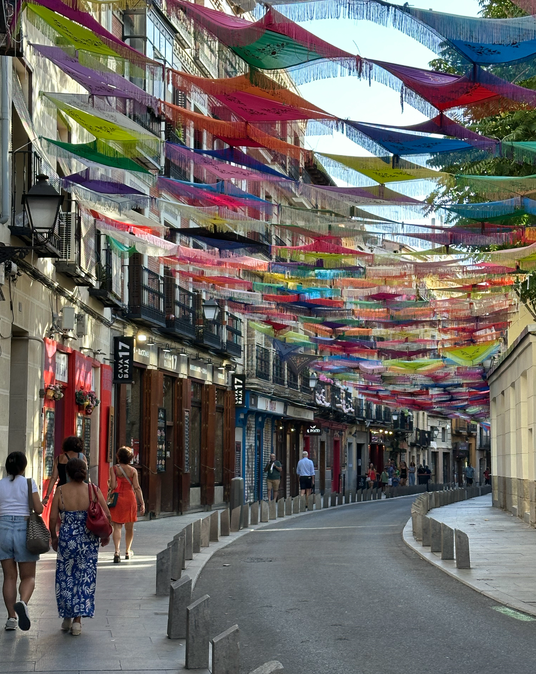La Latina was a fun neighborhood to explore. It is considered one of Madrid's oldest neighborhoods, with winding streets and a medieval feel, also known for wonderful tapas restaurants and lively night life.  
We arrived shortly after the Fiesta de l