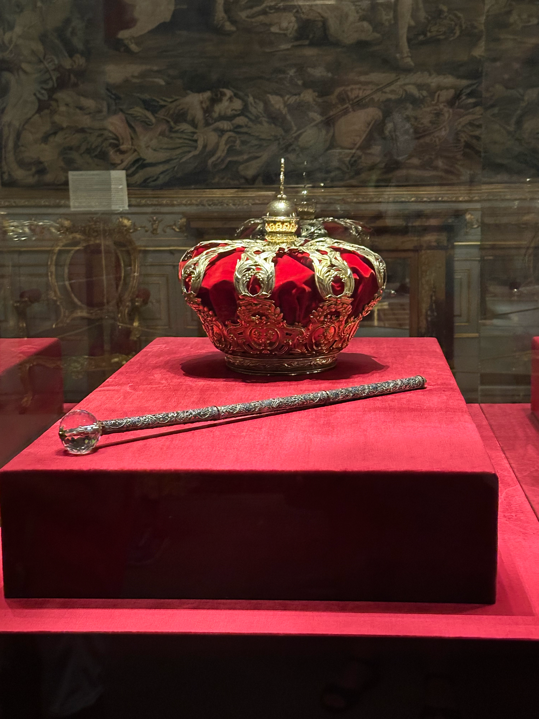 The Royal crown and septre. They are never placed on the King's head and are not part of the coronation ceremony, but are a symbolic display of the throne. 