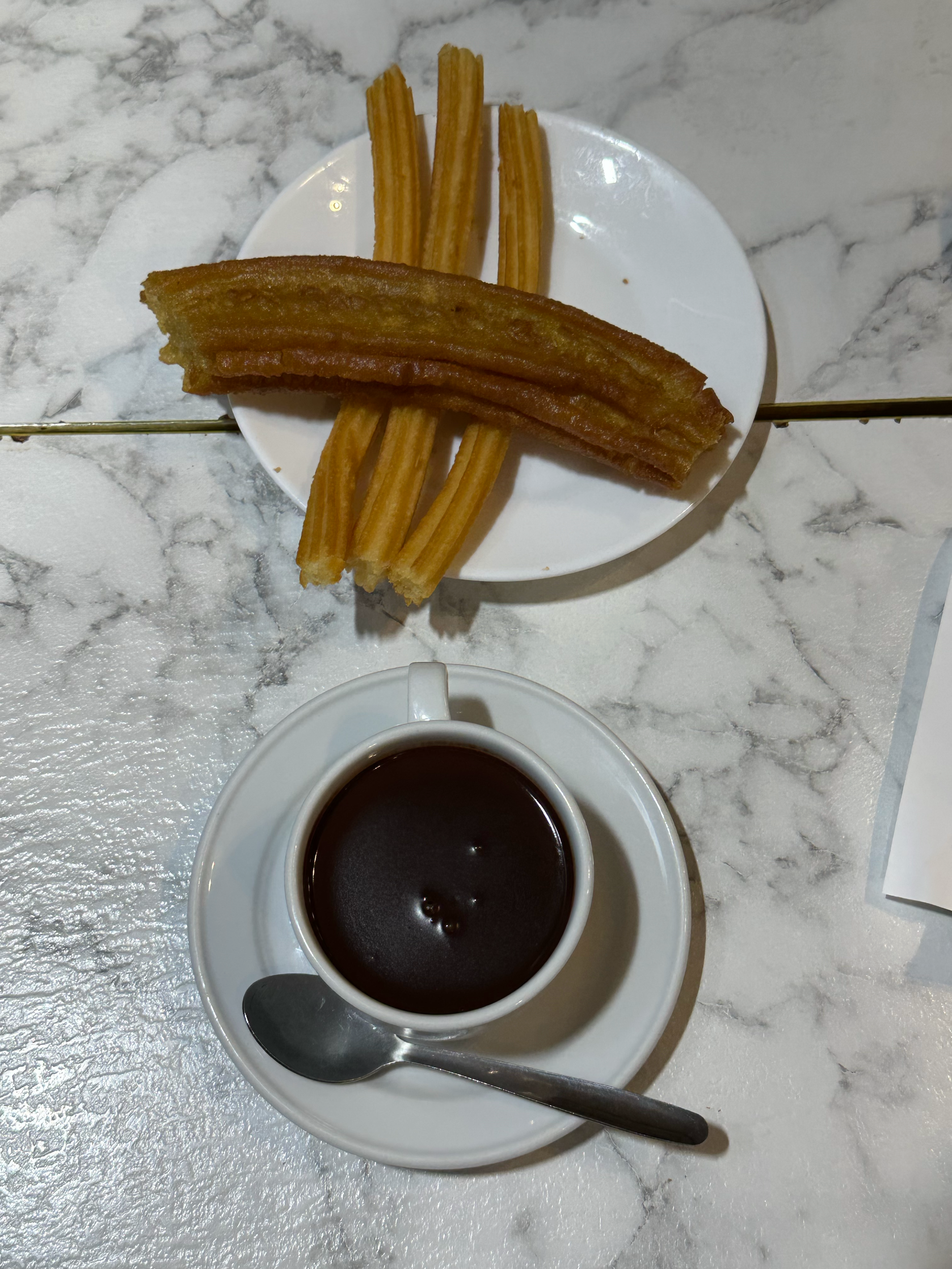 There are thick and thin churros, and you dip them in this thick chocolate sauce!
