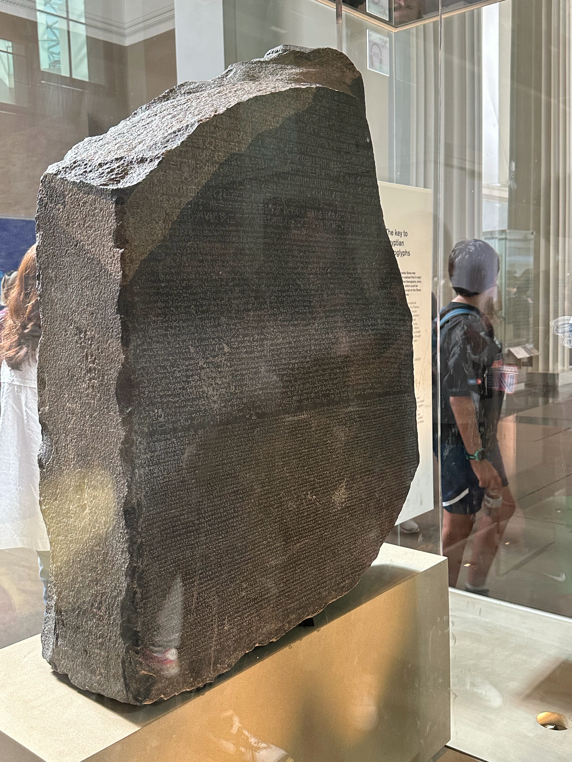 The Rosetta Stone.  It was really hard to get a good picture because of the reflections on the glass, but this gives you an idea.  The stone is a fragment of a larger piece that includes an inscription of the same message in three languages- Ancient 