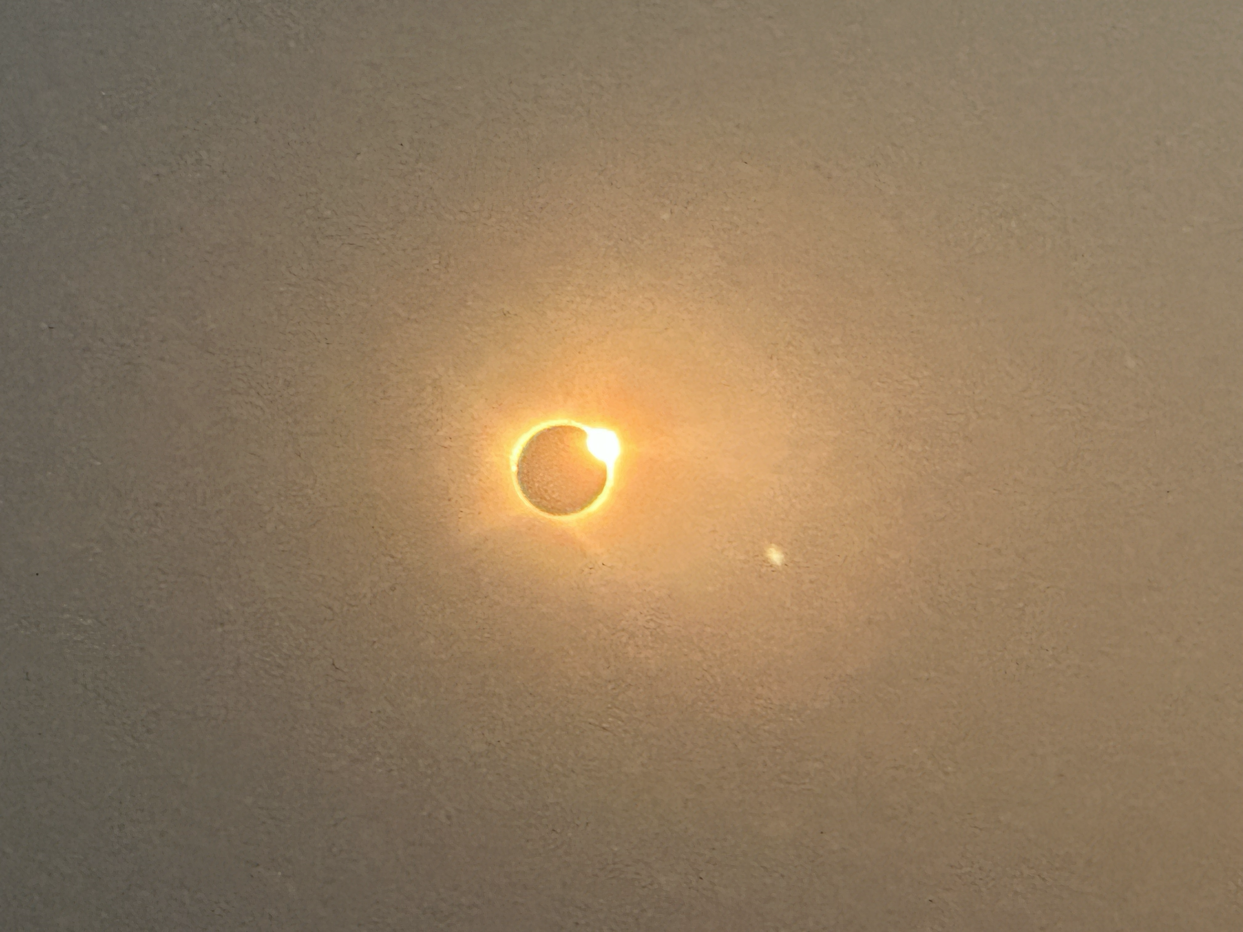 As the moon continued on its path, the sun began to peek out again.  Time to get those protective glasses back on.