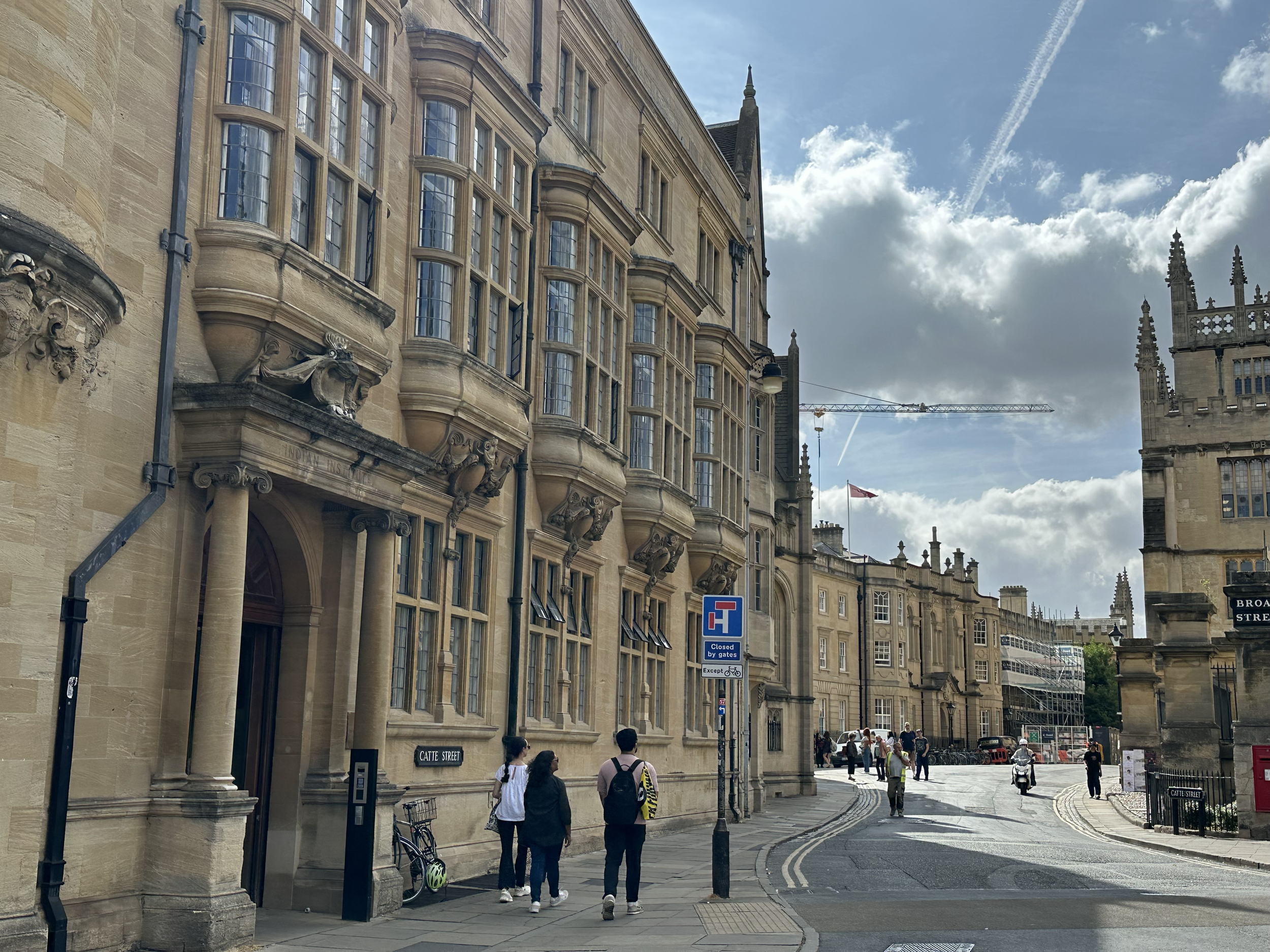 This building was originally the "Indian Institute," but now houses the Oxford Martin School (social sciences).  It sits on the corner of Broad, Holywell, and Catte streets, near the center of Oxford. These old ornate buildings all along the curves r