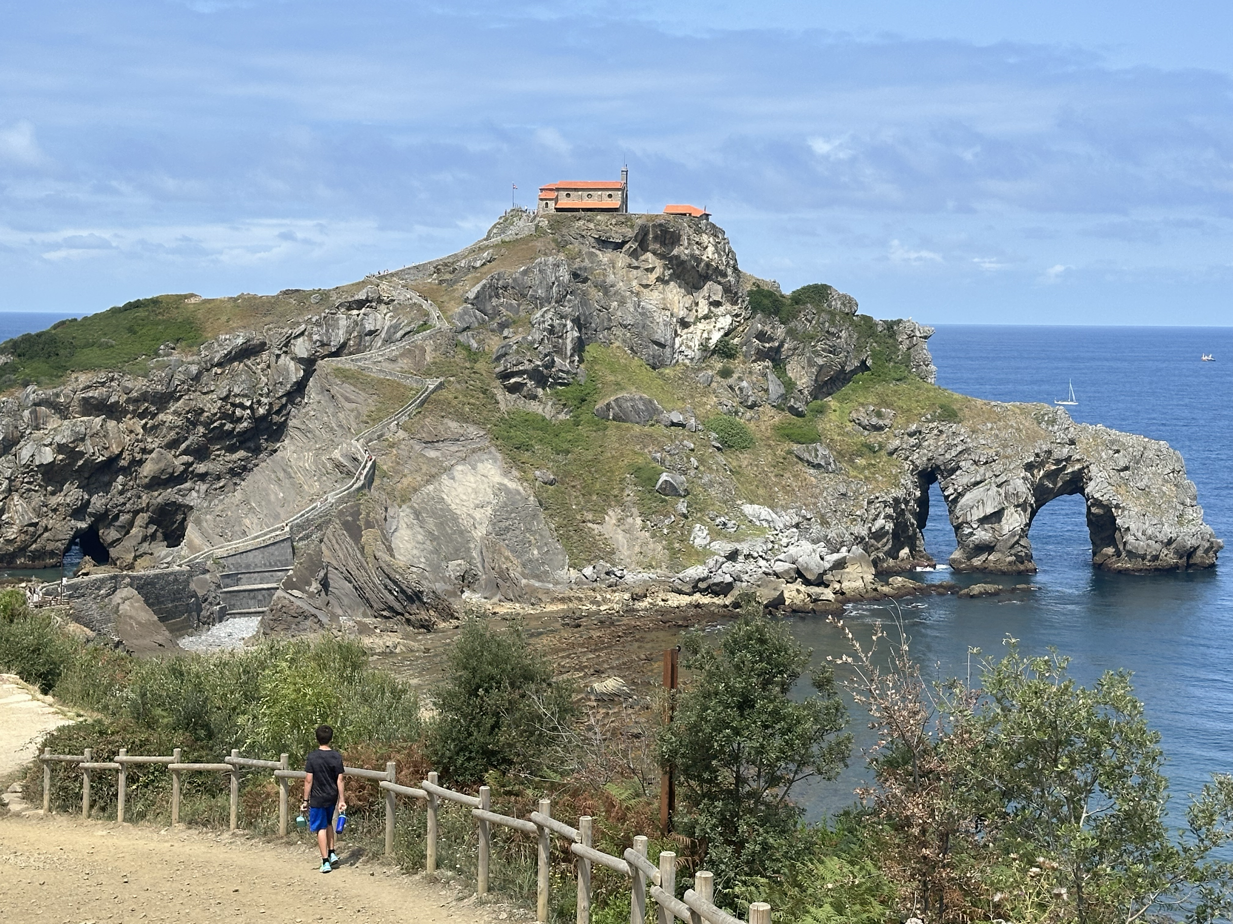 But then we got the real view. Gaztelugatxe is an islet on the Bay of Biscay that is connected to the mainland by a rocky footbridge. At the top of the islet is a church dedicated to St. John the Baptist. The current structure was built in the 1980s,