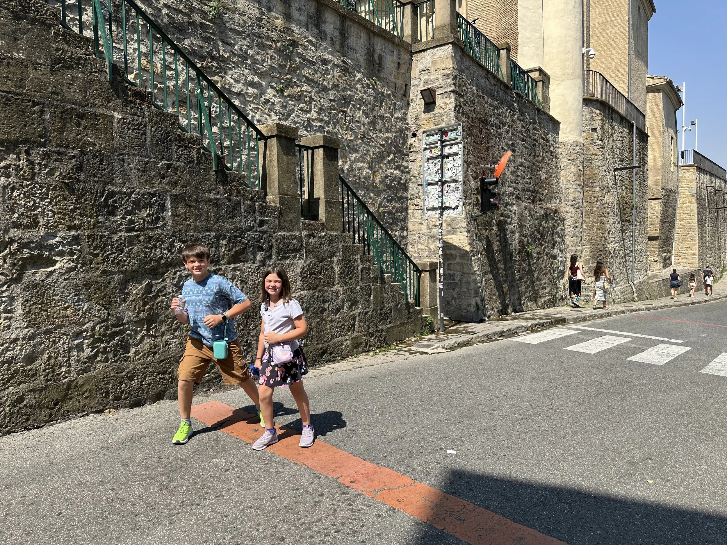 A little ways up the street is the starting line for the runners.  This is where experienced runners would start.  Do these kids look ready to outrun the bulls?
