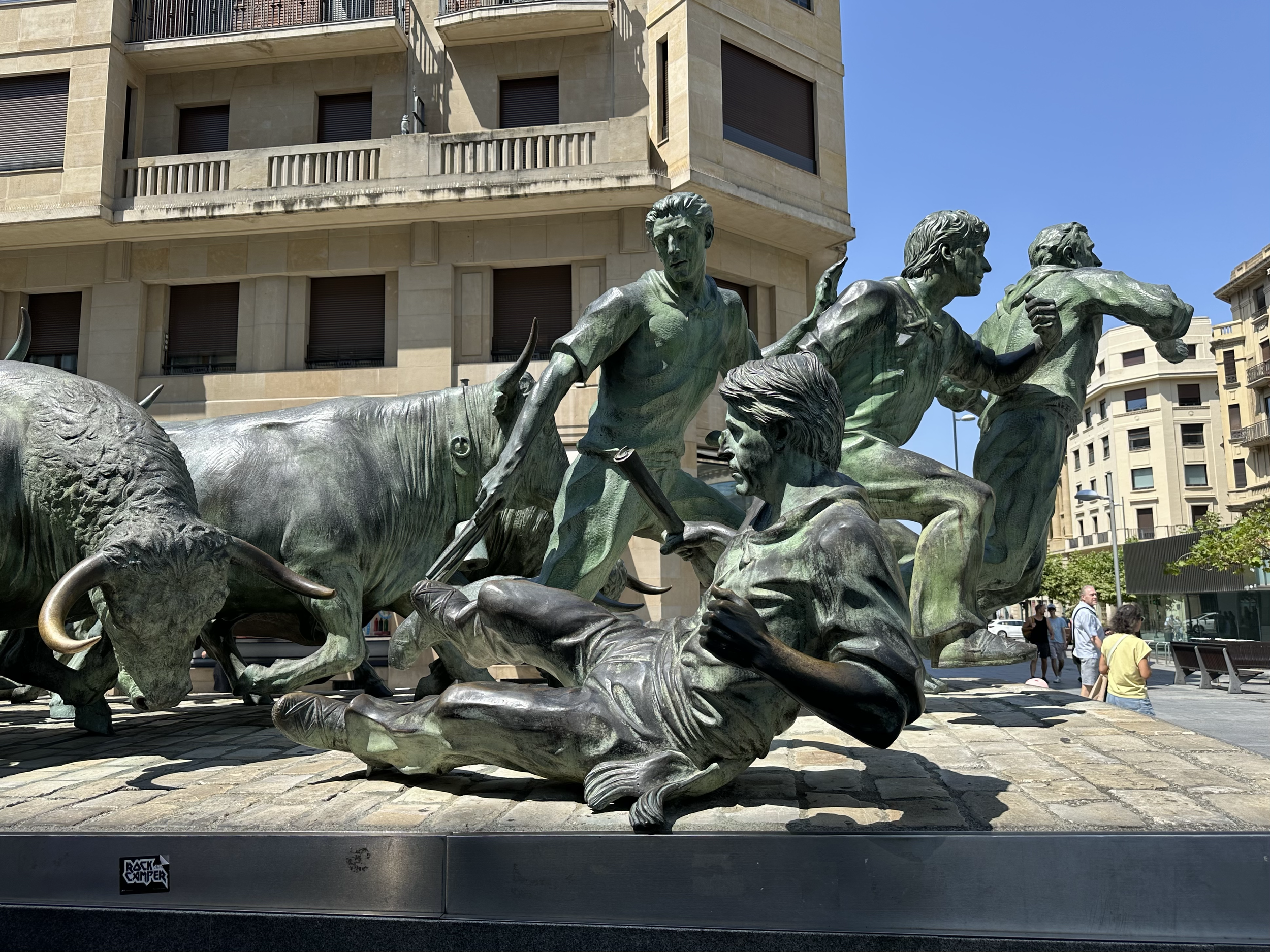Such a life-like depiction with their facial expressions. This portion shows how a runner would hold a rolled up paper and throw it to the side to distract the bulls if they are charging.  