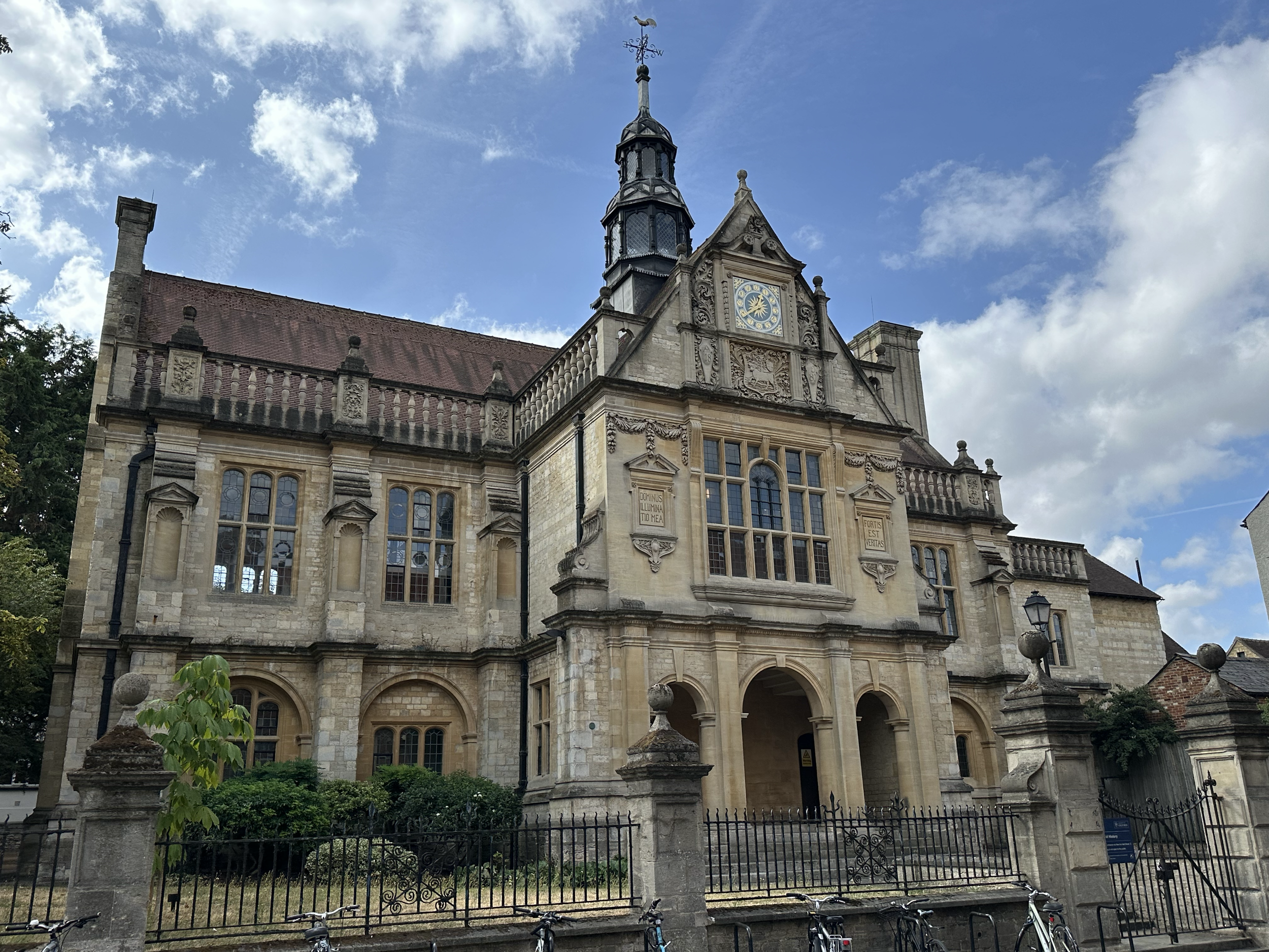 There are 39 independent colleges that are part of the University of Oxford.  They are spread throughout town, so we only saw a few. This is the Faculty of History building located on George Street.  The inscriptions read "Dominus Illumina Tio Mea" (