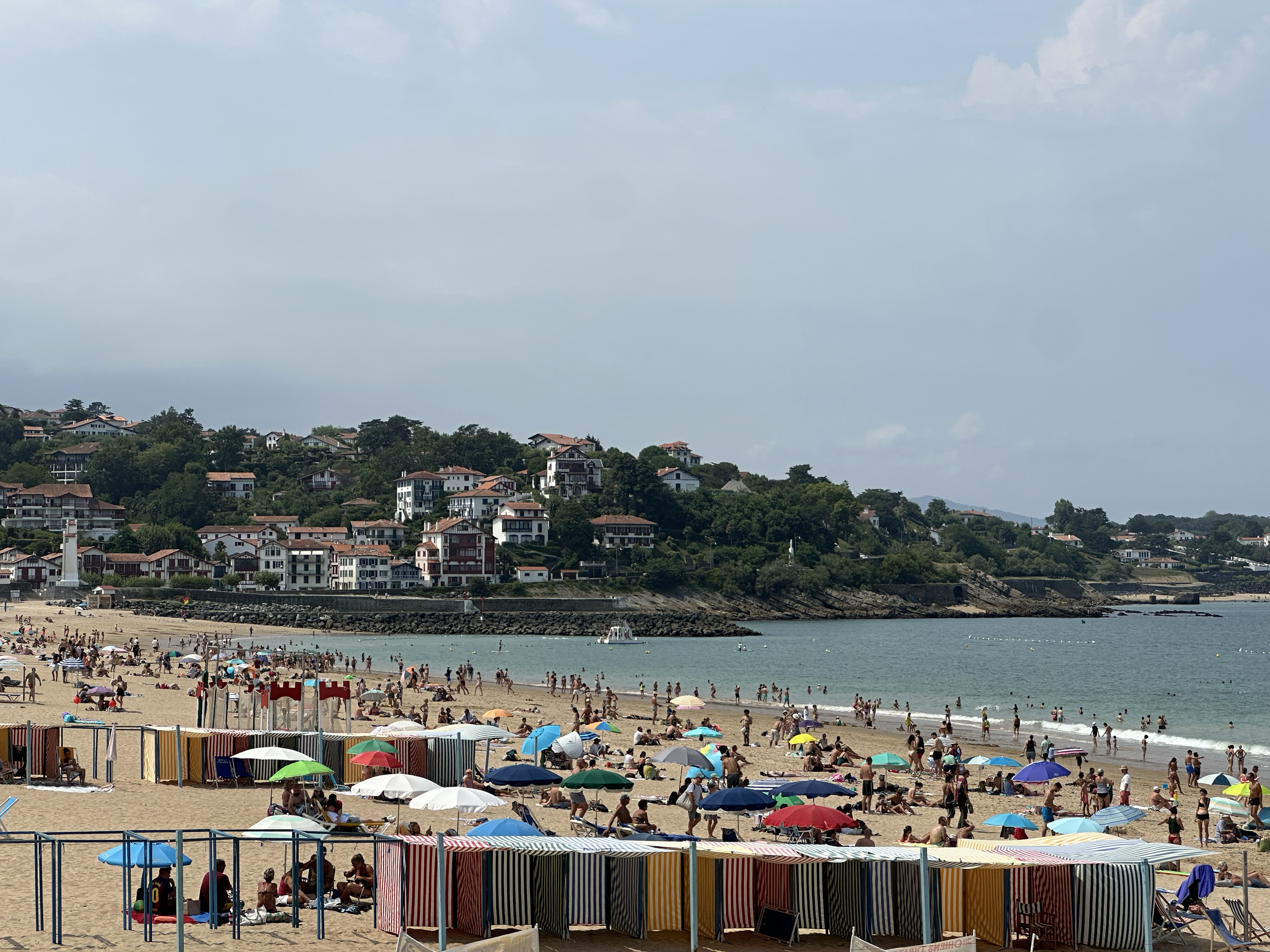 The juxtaposition of the hills, villas, and beach with colorful changing tents felt like stepping back in time.