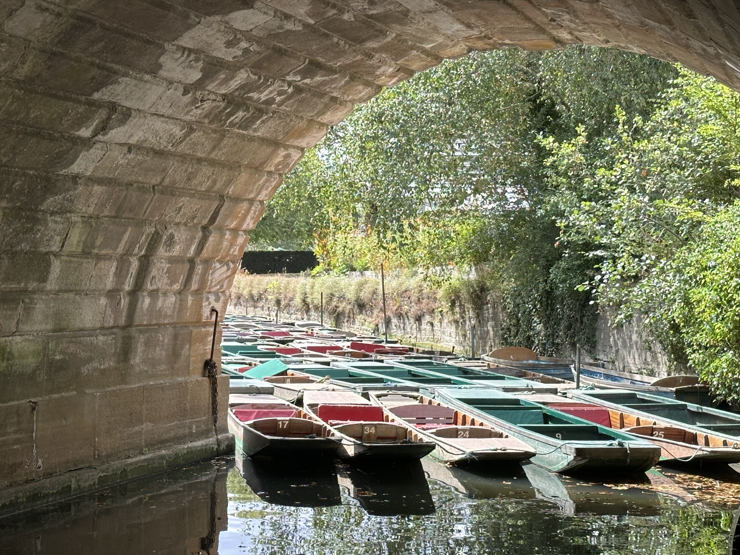 Punting boats beneath Magdalen Bridge
