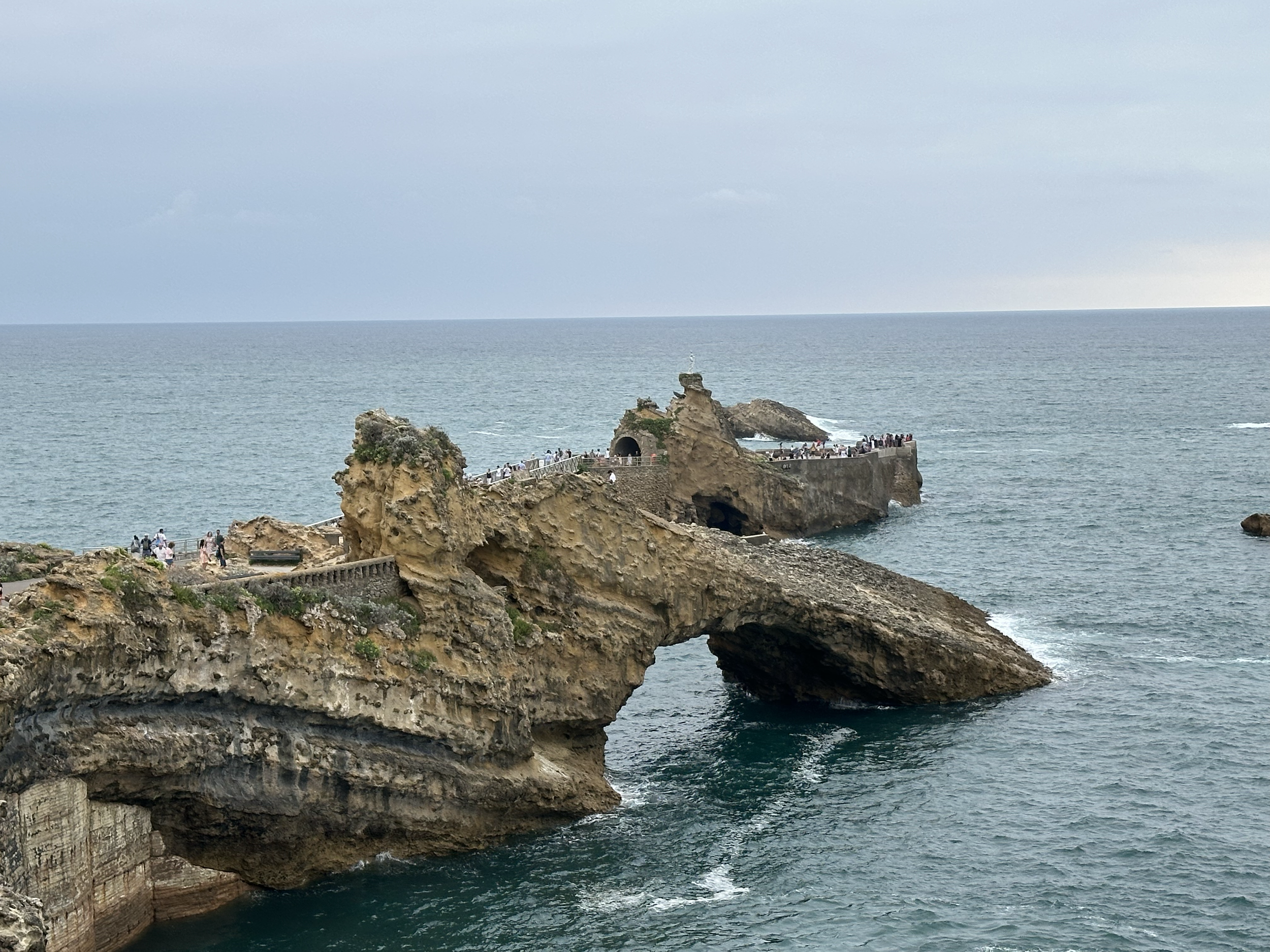 Rocher de la Vierge (Rock of the Virgin). Legend has it that whalers were caught in a storm and guided back to shore by a bright light shining from this light.  As a means of gratitude, a 3 ft bronze statue of the Virgin Mary was placed on the summit