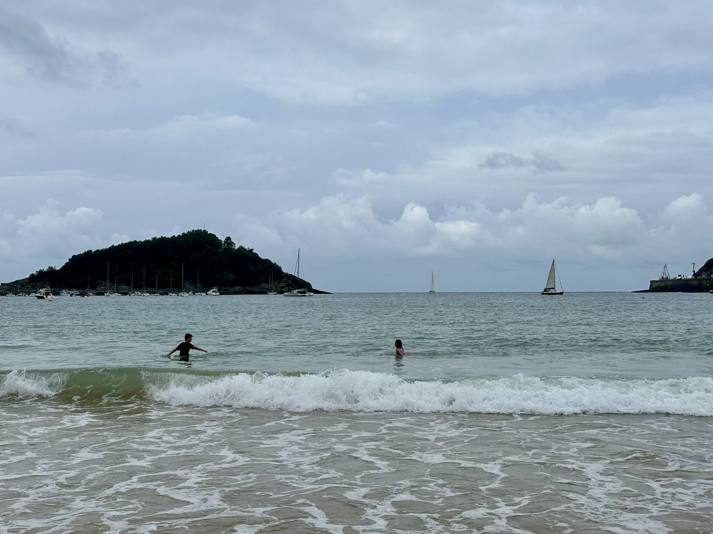 The kids stayed parallel to shore and walked/swam/played in the water all the way from one end of La Concha to the other.  