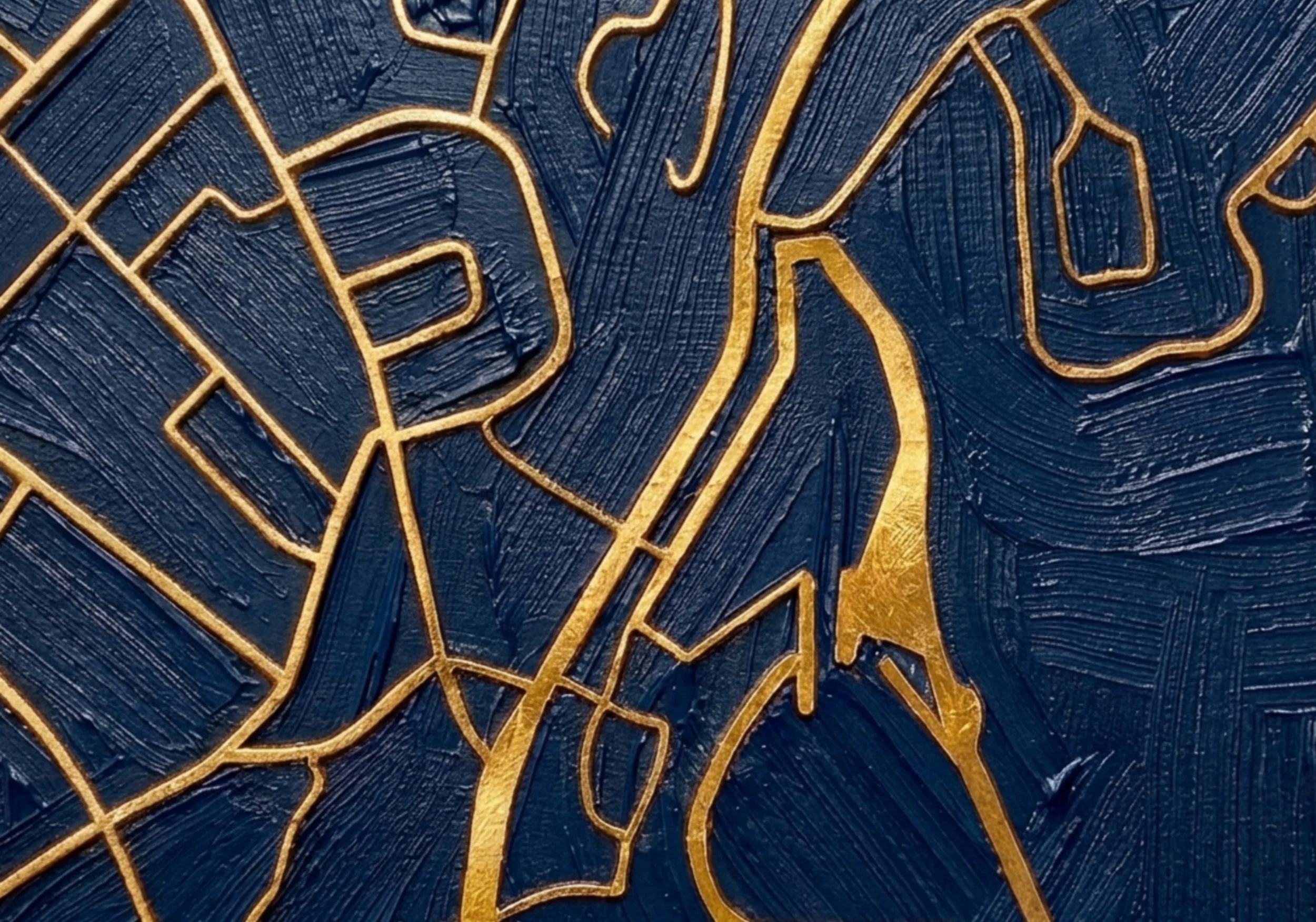 Close-up of a textured surface with intricate golden lines forming a geometric and floral pattern on a dark blue background.
