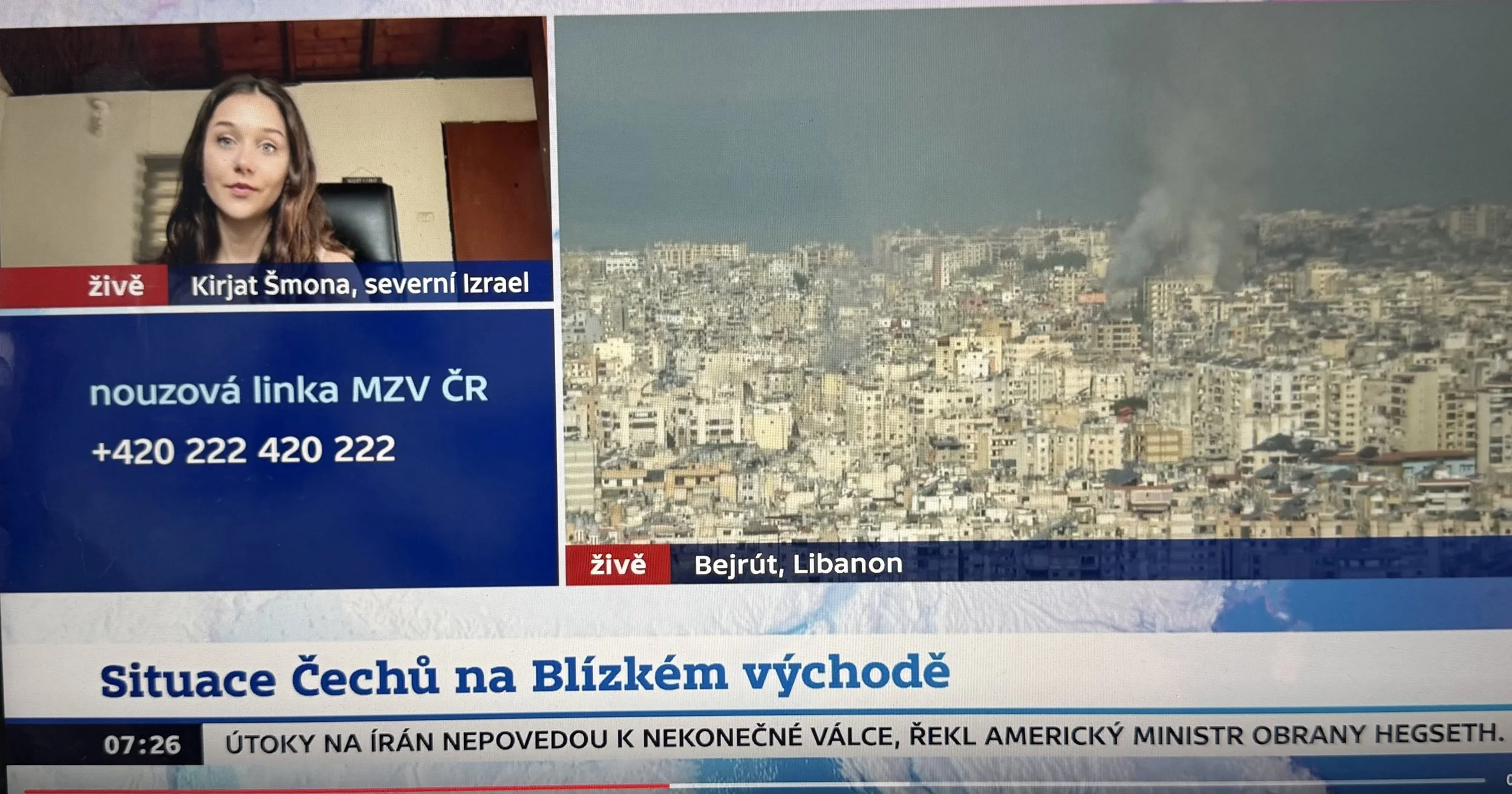 Screenshot of a news broadcast with a woman speaking about Israel and Lebanon, a cityscape with smoke rising from buildings in Beirut, and text in Czech and Arabic discussing Ukraine, Lebanon, and a military conflict.
