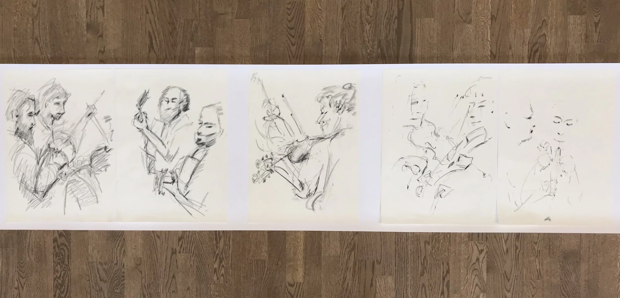 Six sketches of musicians playing string instruments, drawn in black ink on white paper, laid out on a wooden floor.